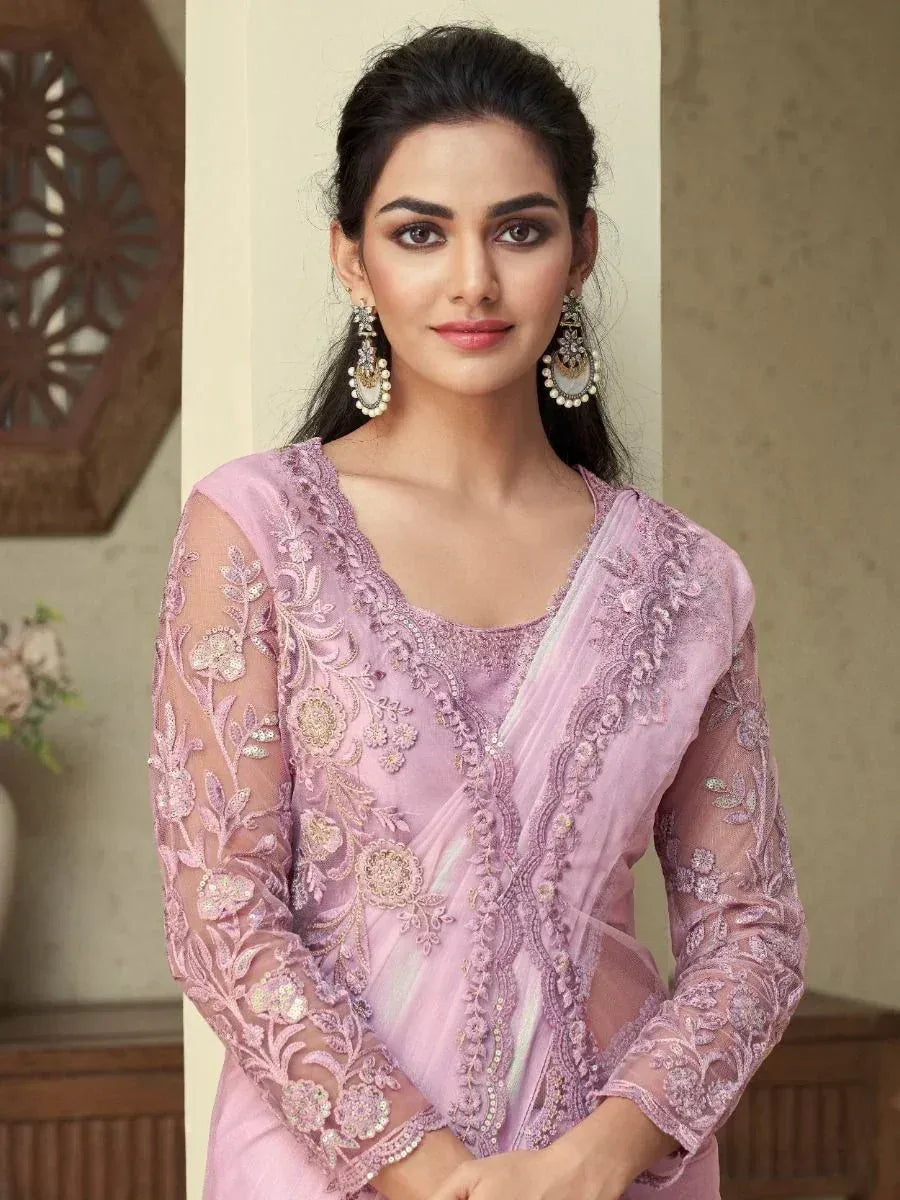 Elegant lavender ethnic gown with floral embroidery and sheer sleeves, perfect for Indian celebrations