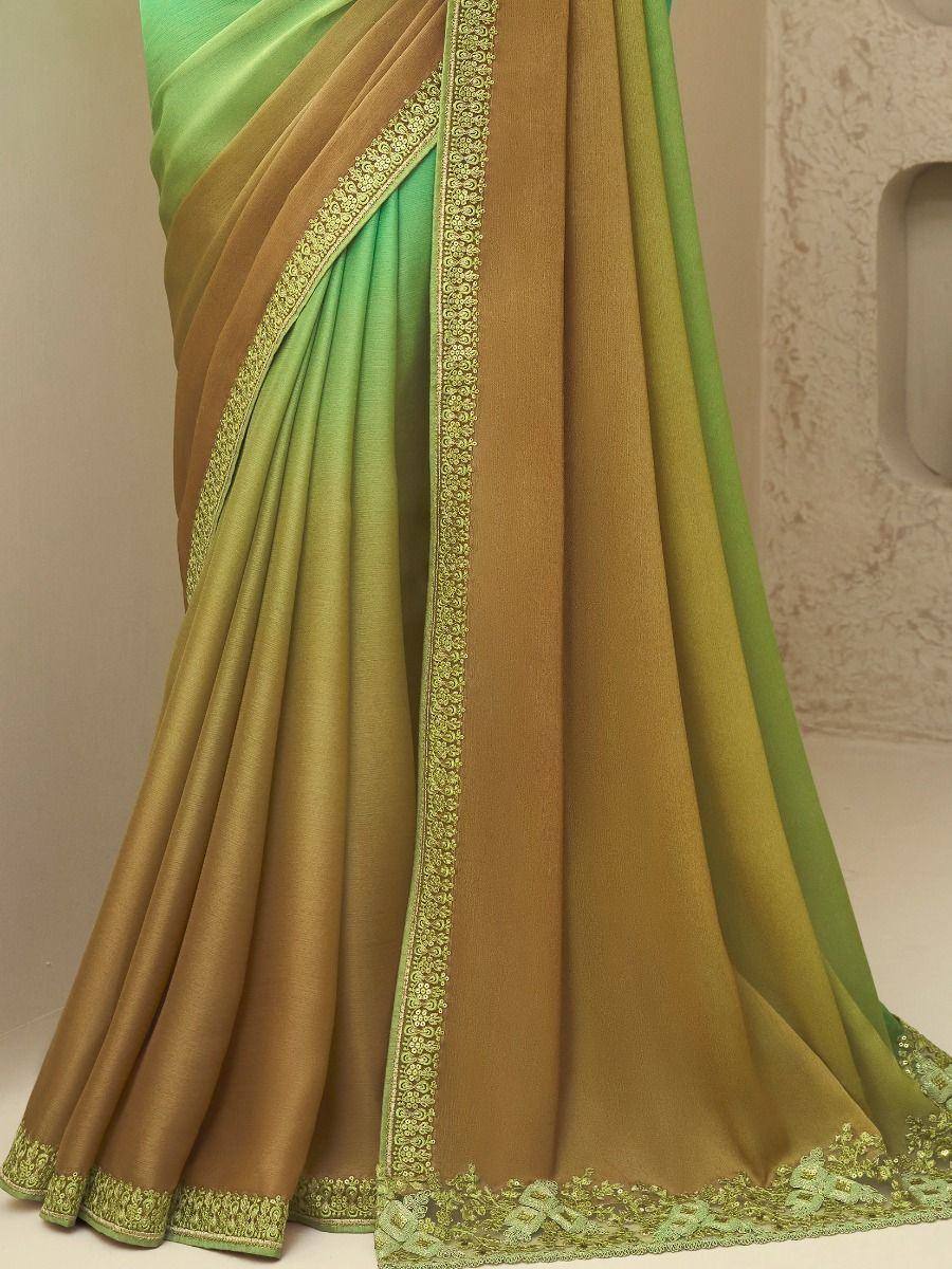 Green and gold ethnic saree with embroidered border, perfect for Indian occasions