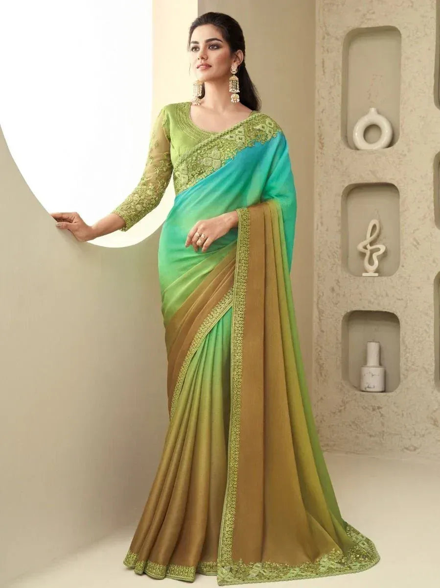 Elegant green and gold saree with intricate embroidery, perfect for ethnic occasions.