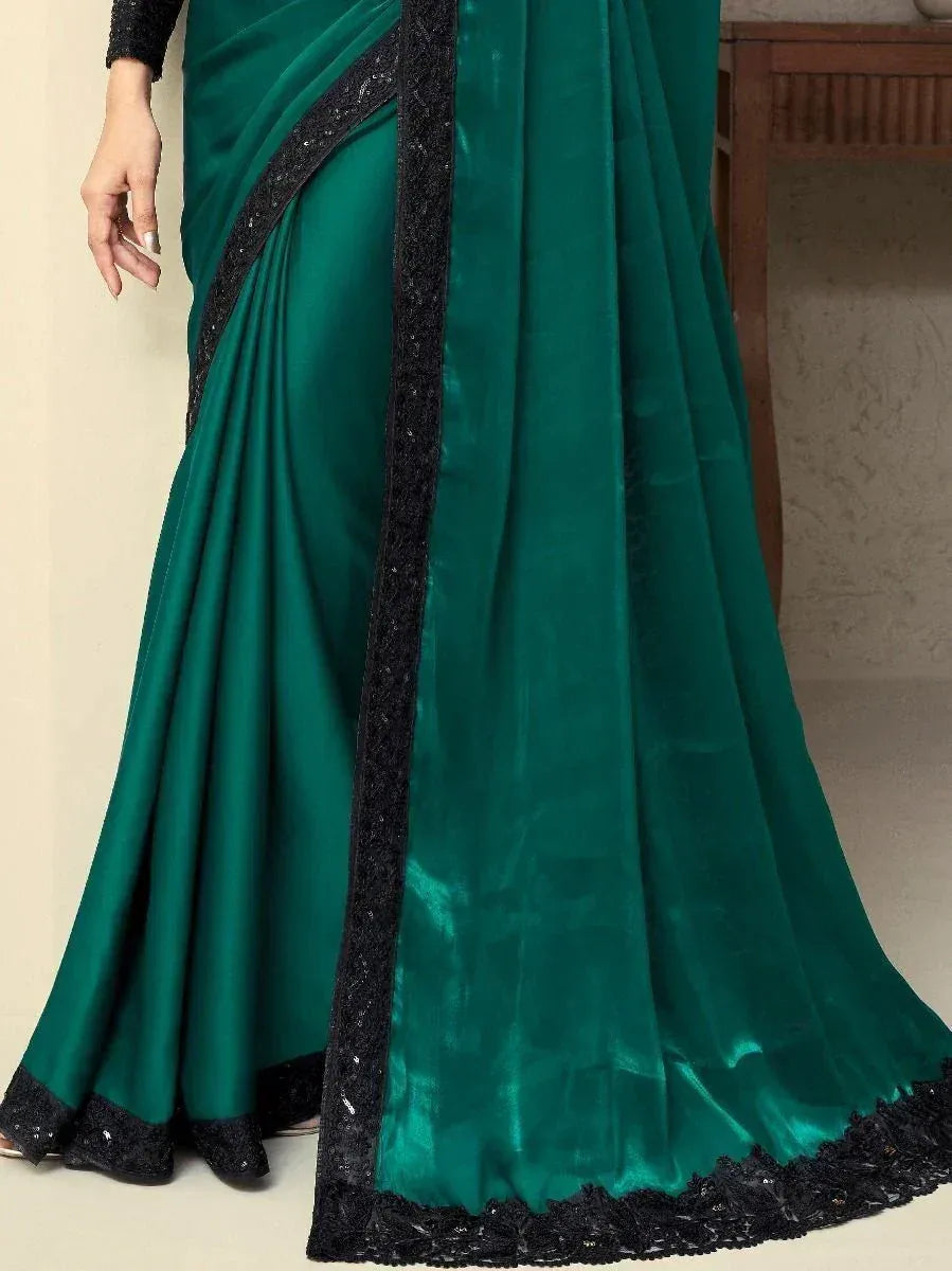 Emerald green saree with black lace border, elegant ethnic wear for women