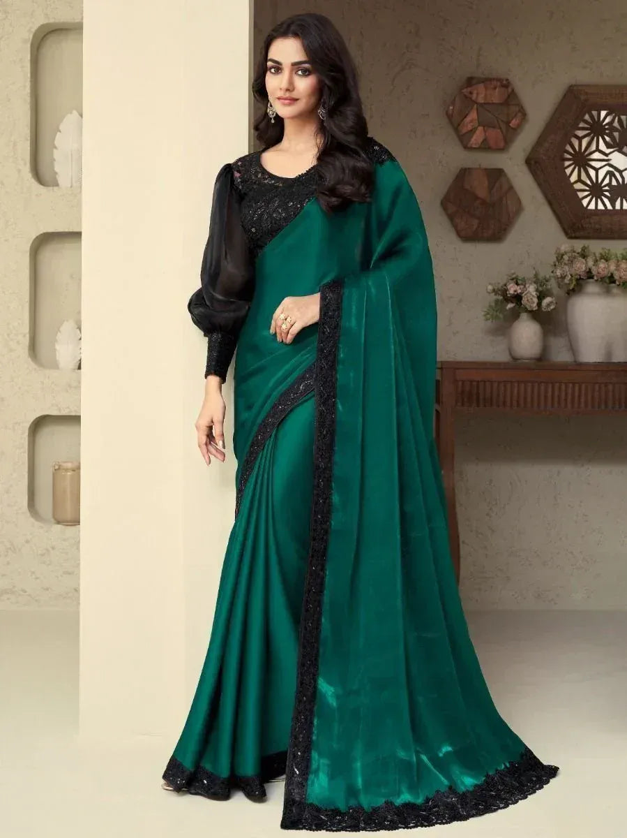 Emerald green saree with black lace border and sheer sleeves, elegant Indian ethnic wear