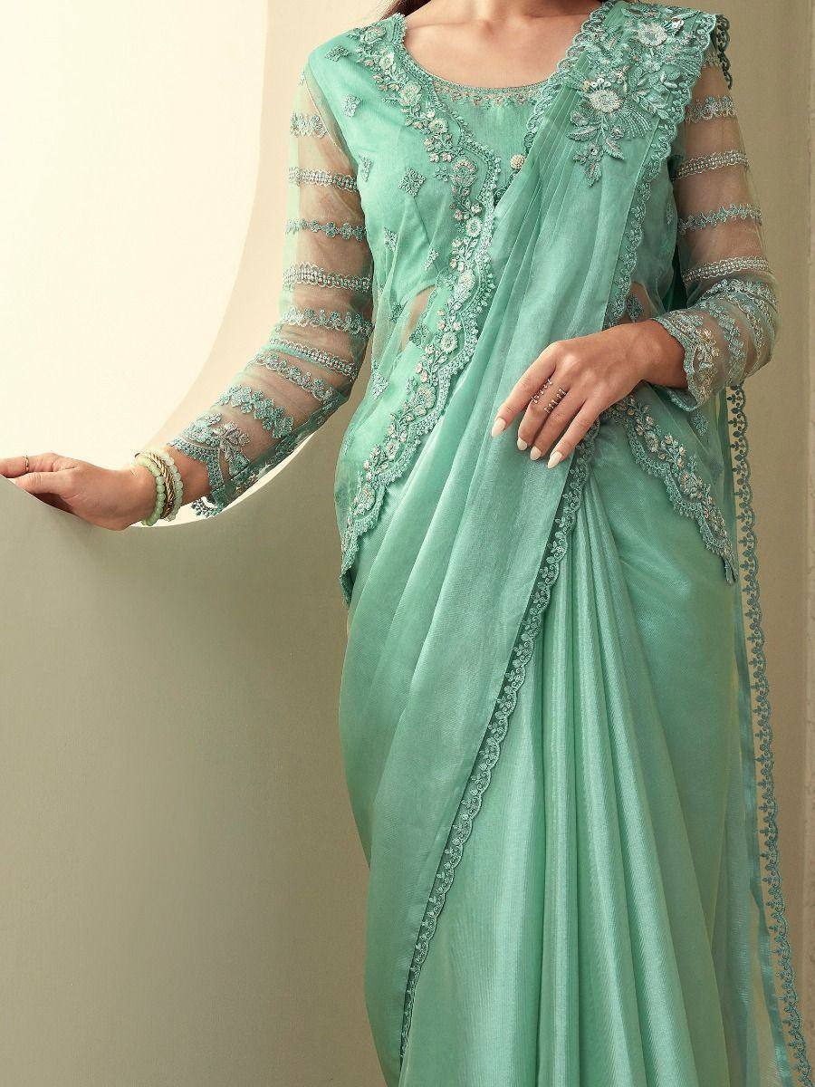 Mint green designer saree with floral embroidery and sheer sleeves, perfect for ethnic occasions