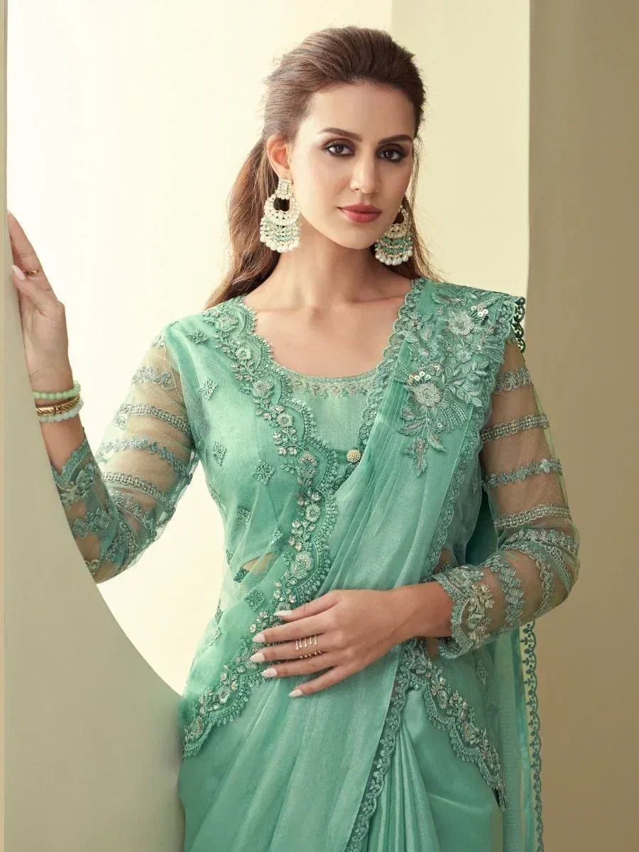 Mint green embroidered saree with sheer sleeves, perfect for Indian ethnic occasions and festive wear.