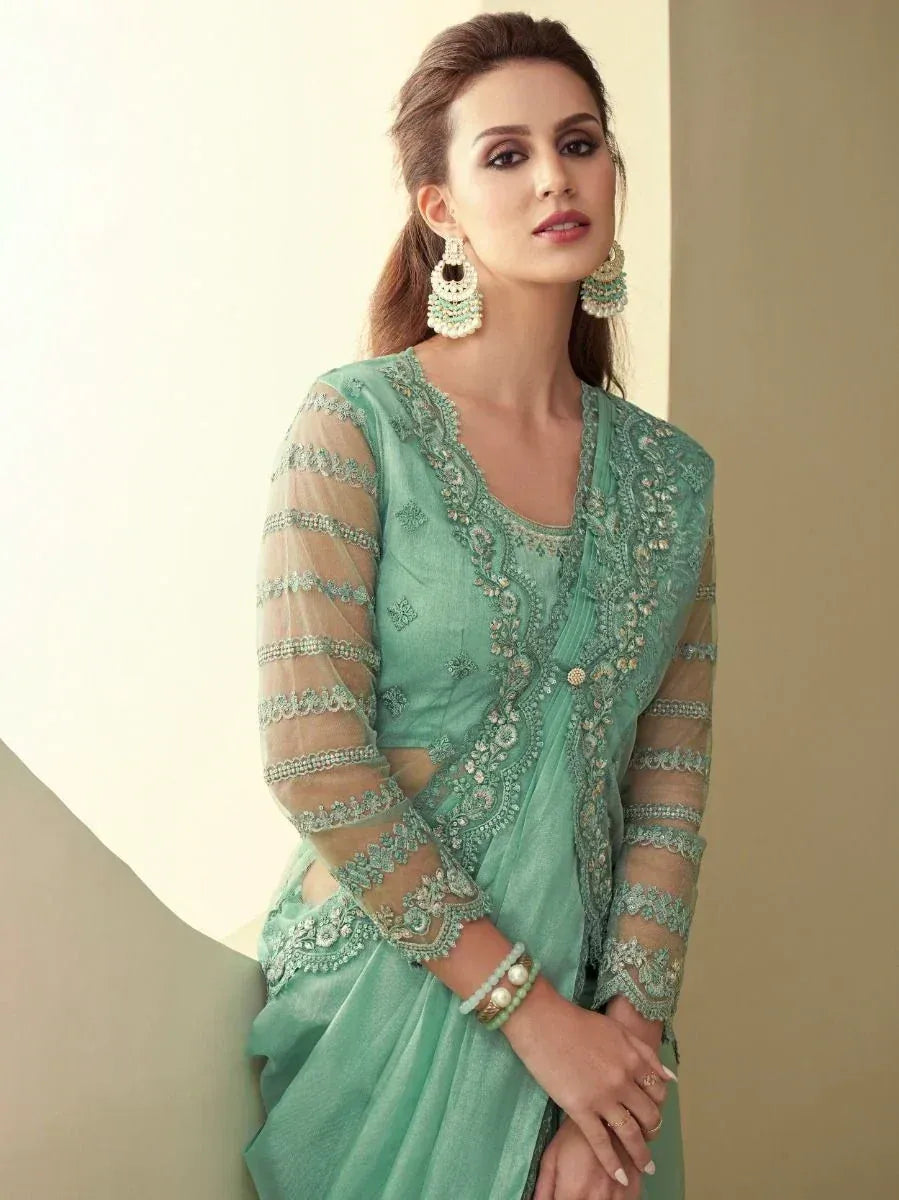Mint green embroidered salwar kameez with sheer sleeves, perfect for ethnic occasions and festive wear.