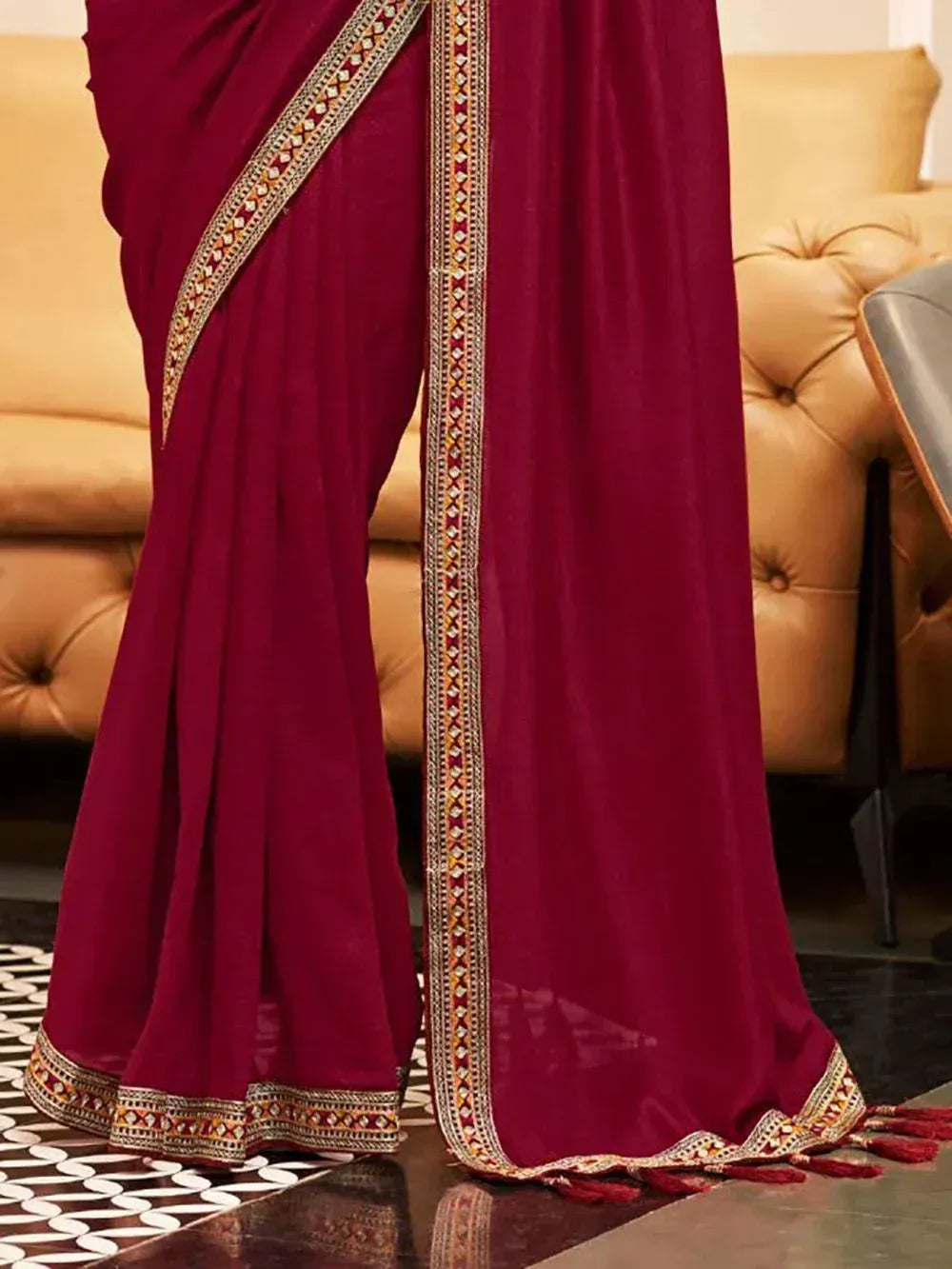 Maroon saree with gold and red embroidered border, perfect for Indian ethnic occasions