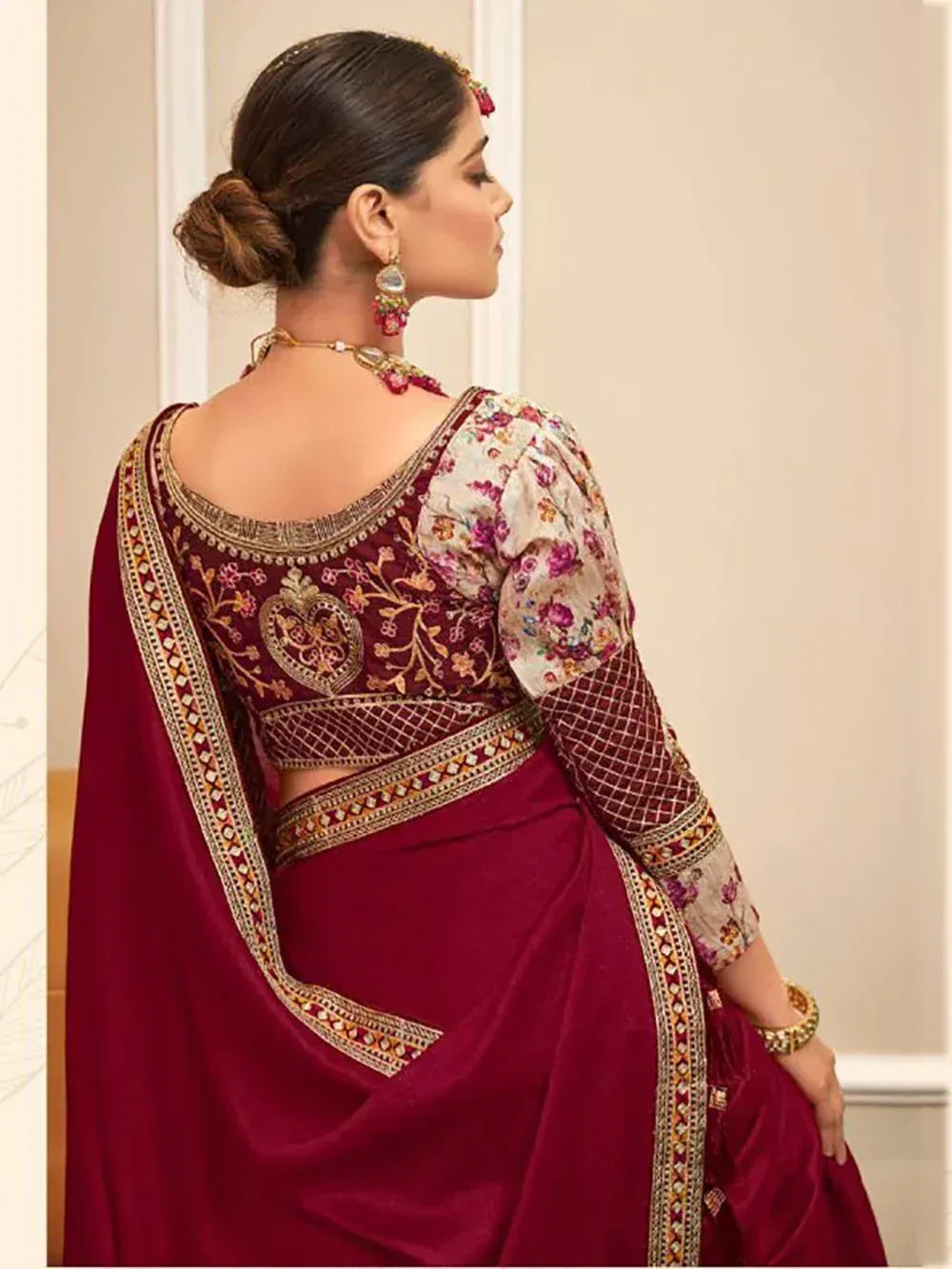 Maroon embroidered saree with floral blouse, gold border, and back detailing for Indian ethnic wear