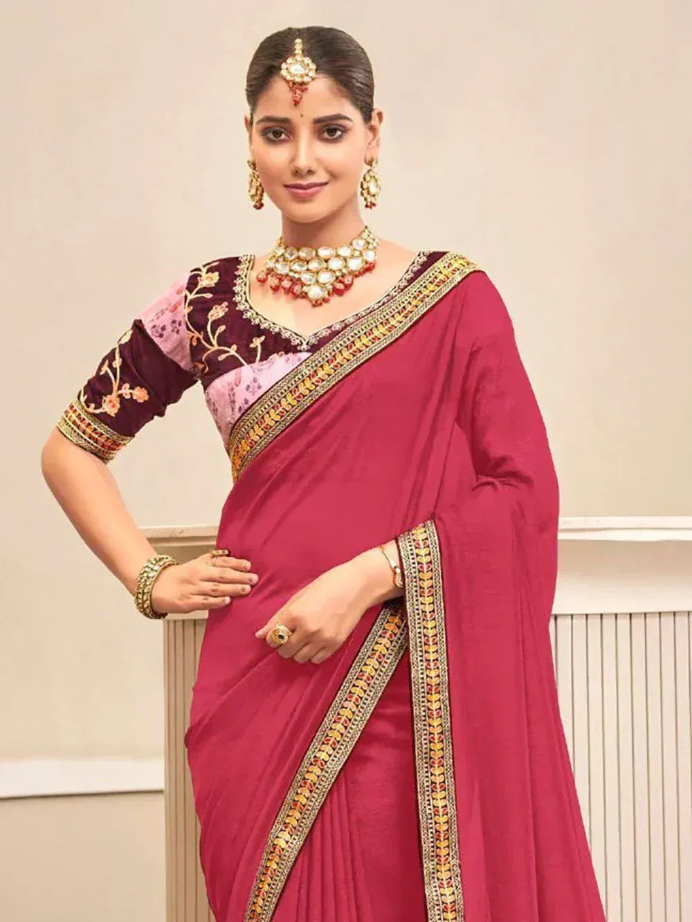 Elegant maroon saree with gold border, floral blouse, and traditional jewelry for Indian ethnic wear