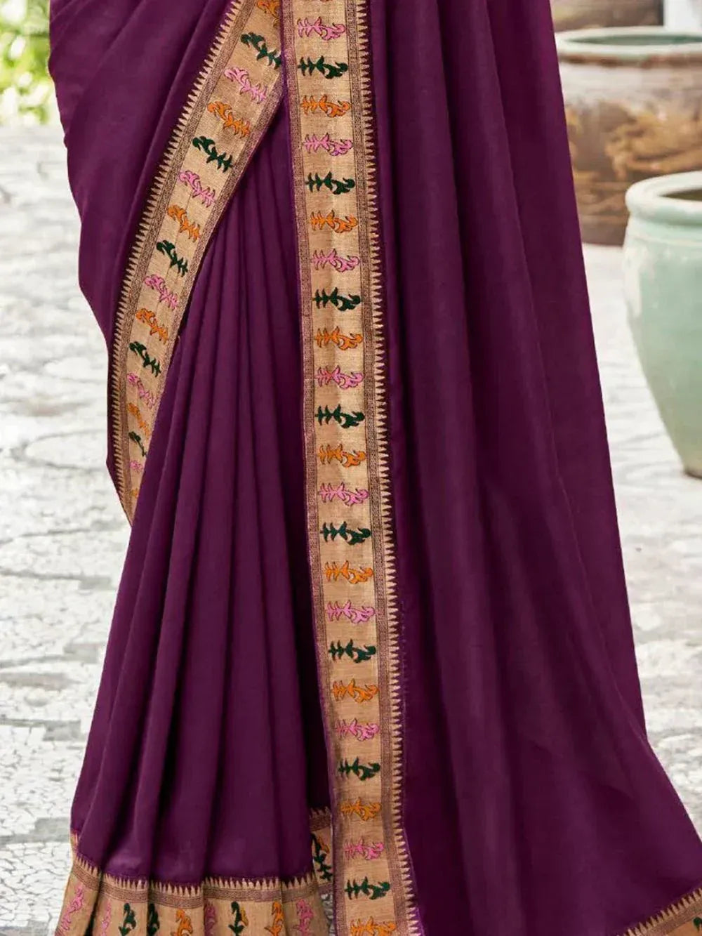 Purple ethnic saree with colorful floral border embroidery, perfect for Indian occasions