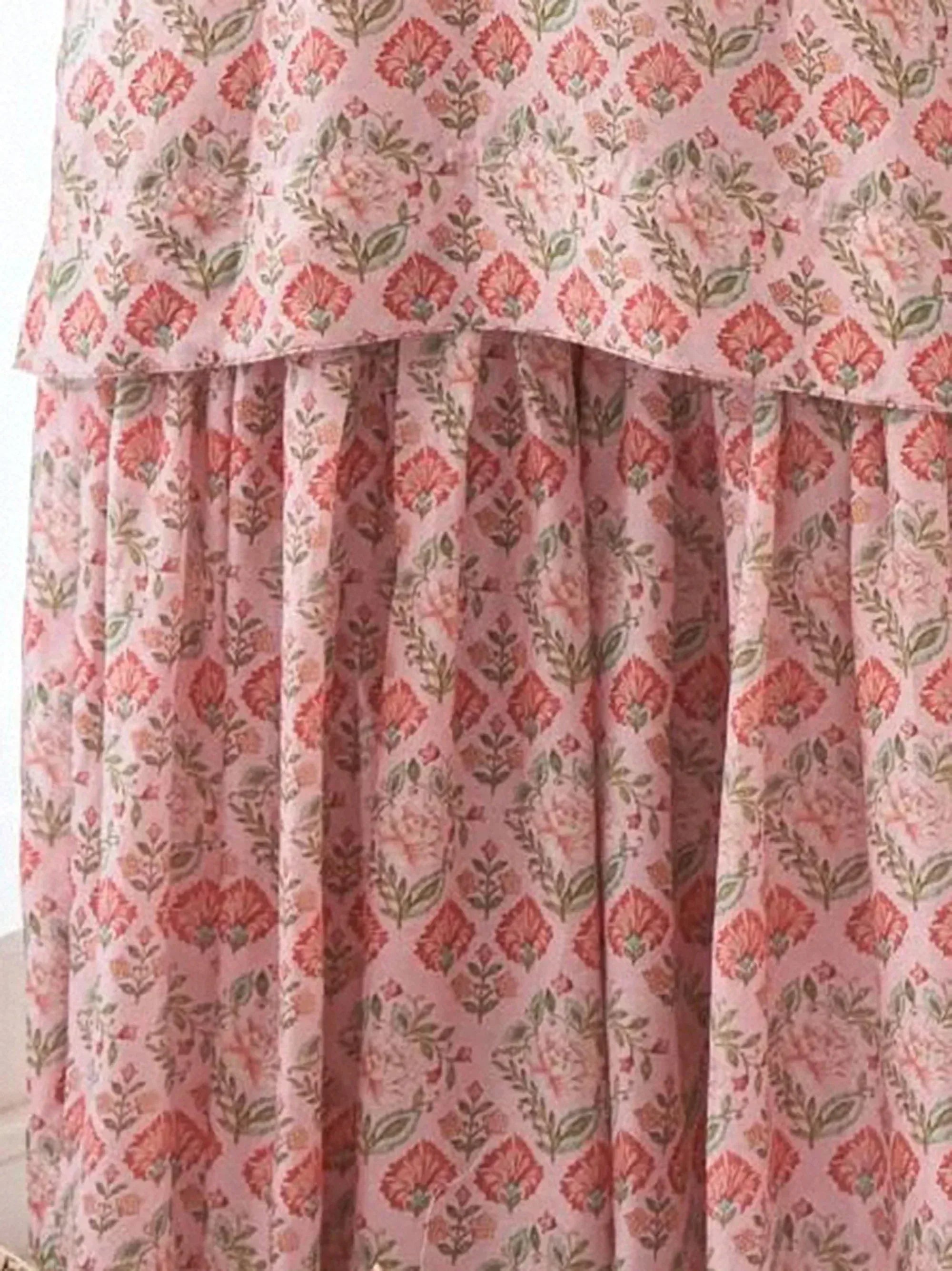 Pink floral print ethnic gown with layered ruffle hem, perfect for Indian occasions