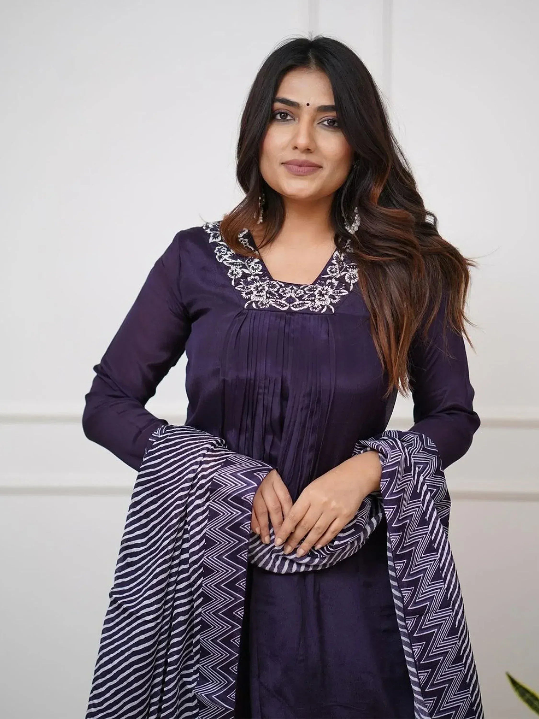 Purple ethnic kurti with white floral embroidery and geometric patterned dupatta, stylish Indian wear