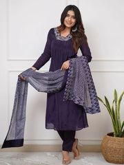 Woman in purple ethnic salwar kameez with printed dupatta from Ethnic Plus