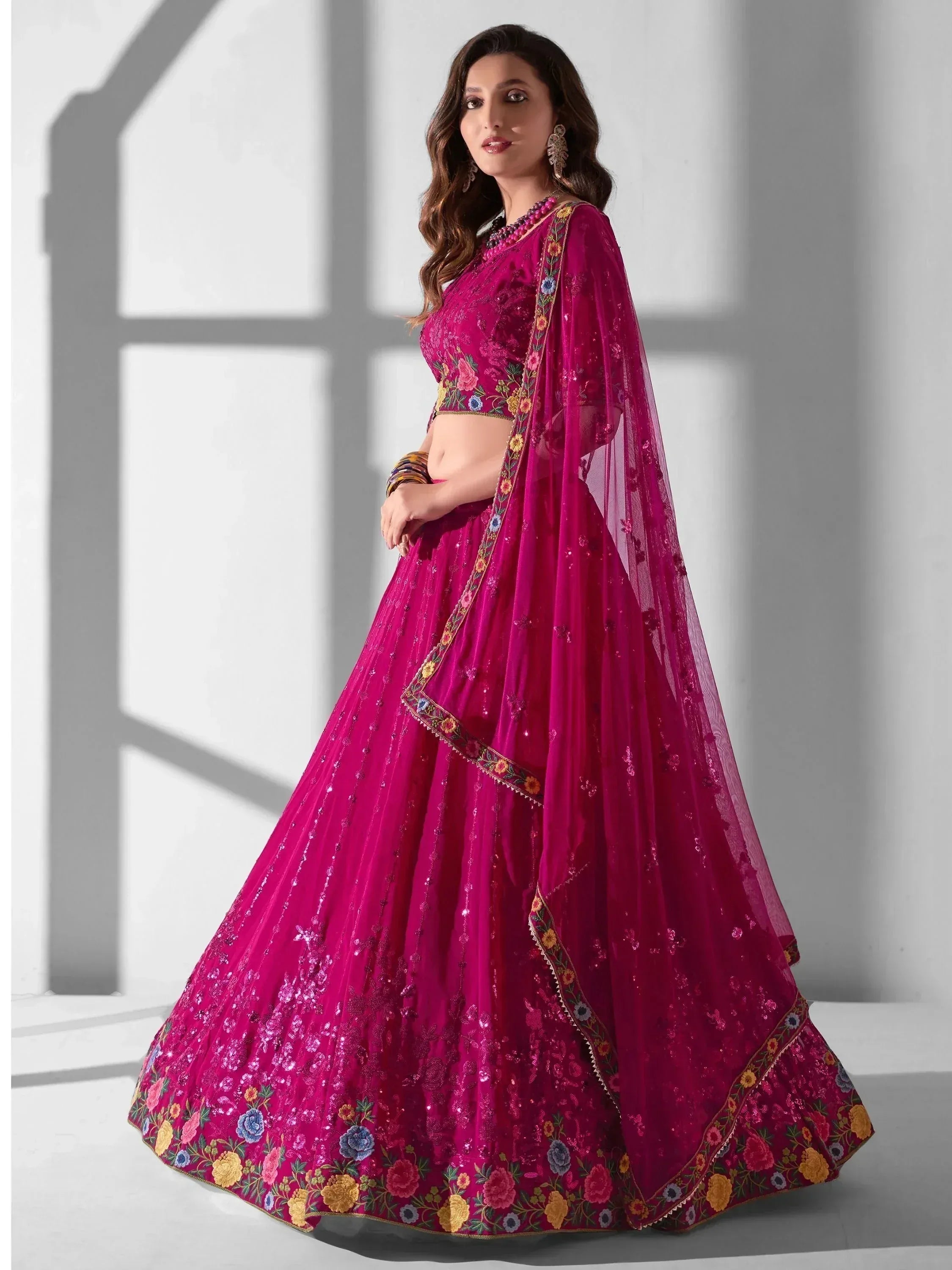 Fuchsia designer lehenga choli with floral embroidery and sequins, perfect for Indian ethnic wear occasions