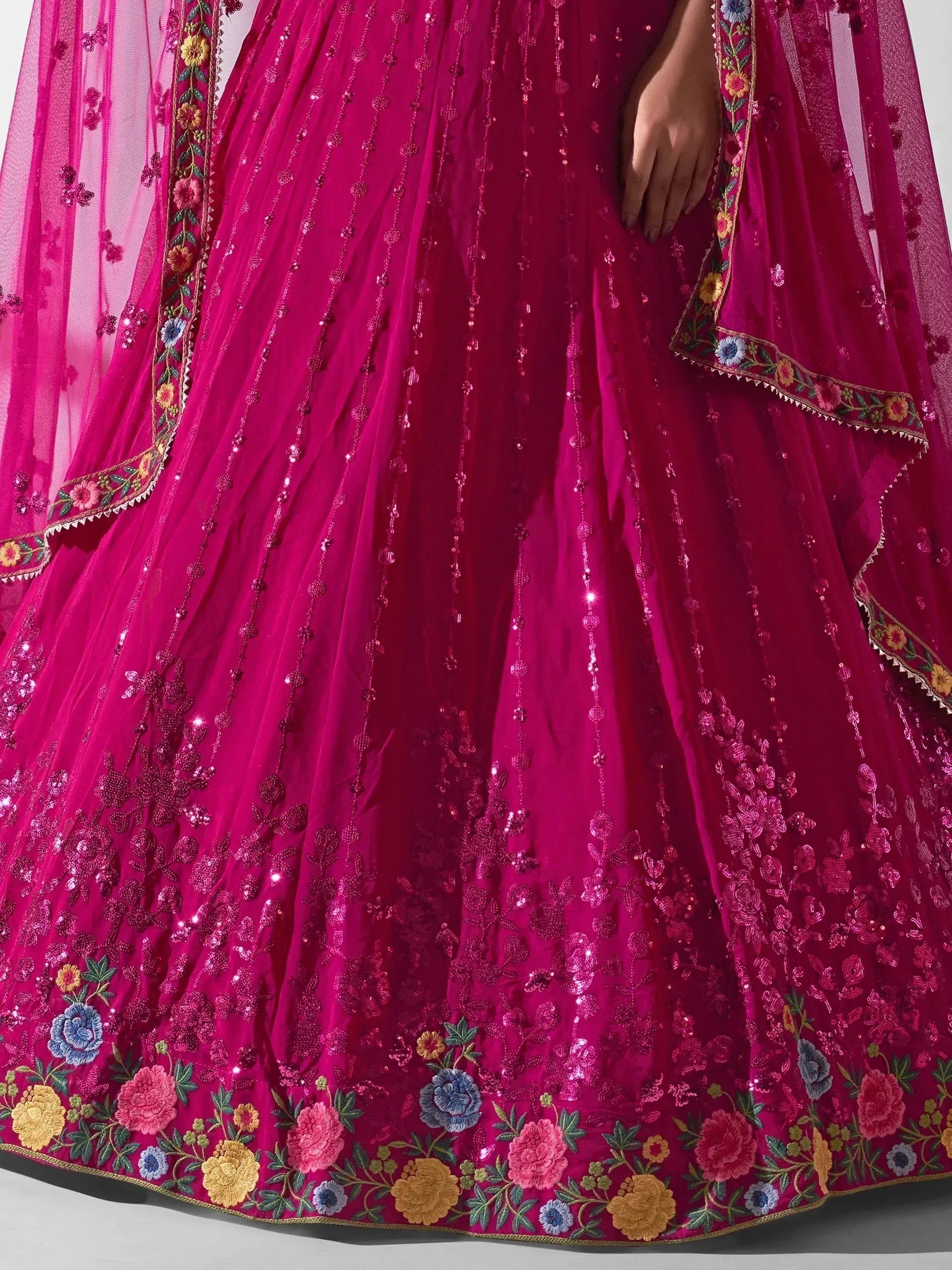 Fuchsia lehenga choli with floral embroidery and sequin detailing, perfect for Indian ethnic wear