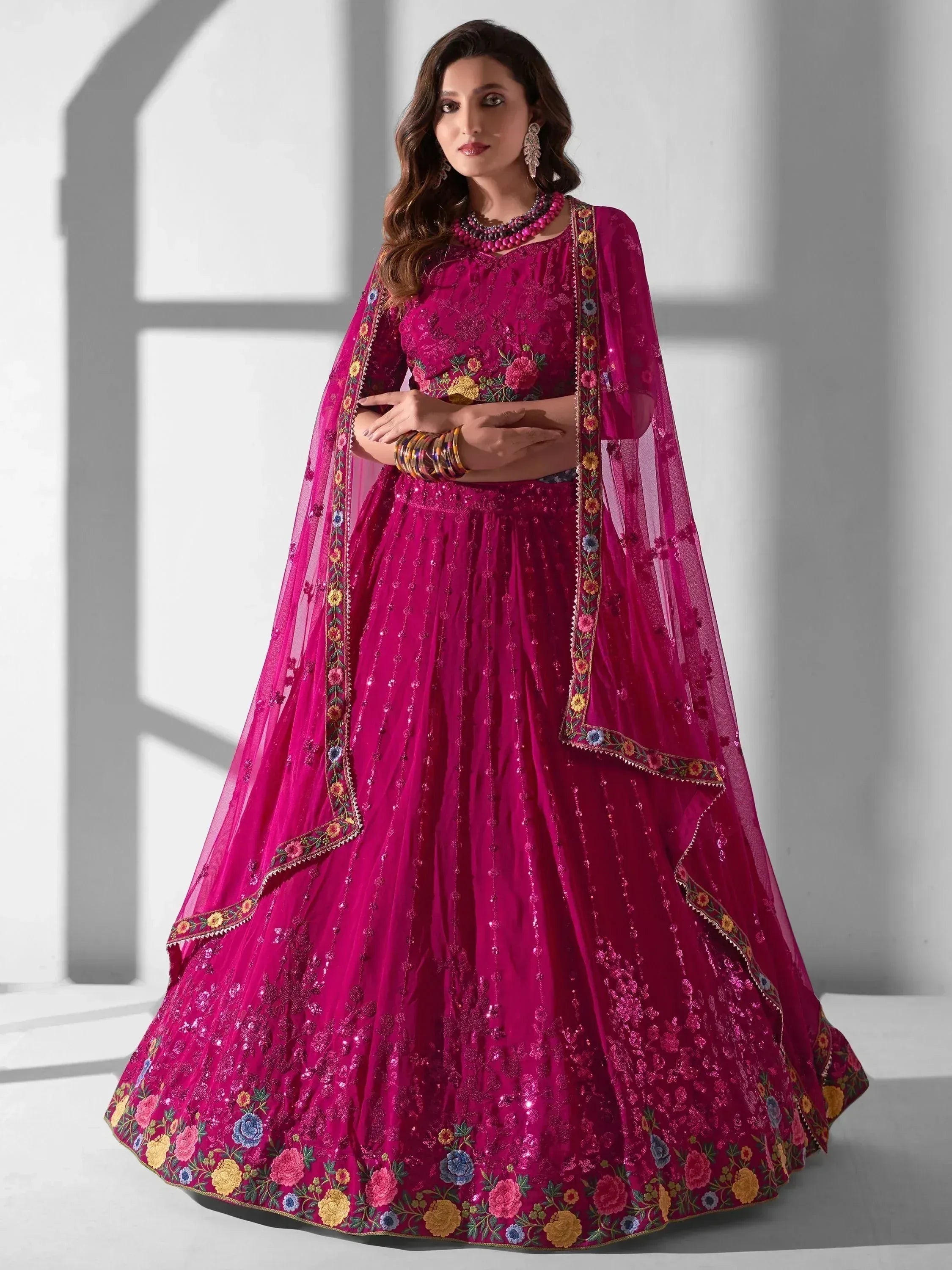 Fuchsia embroidered lehenga choli with floral dupatta, Indian ethnic wear for weddings and festivals