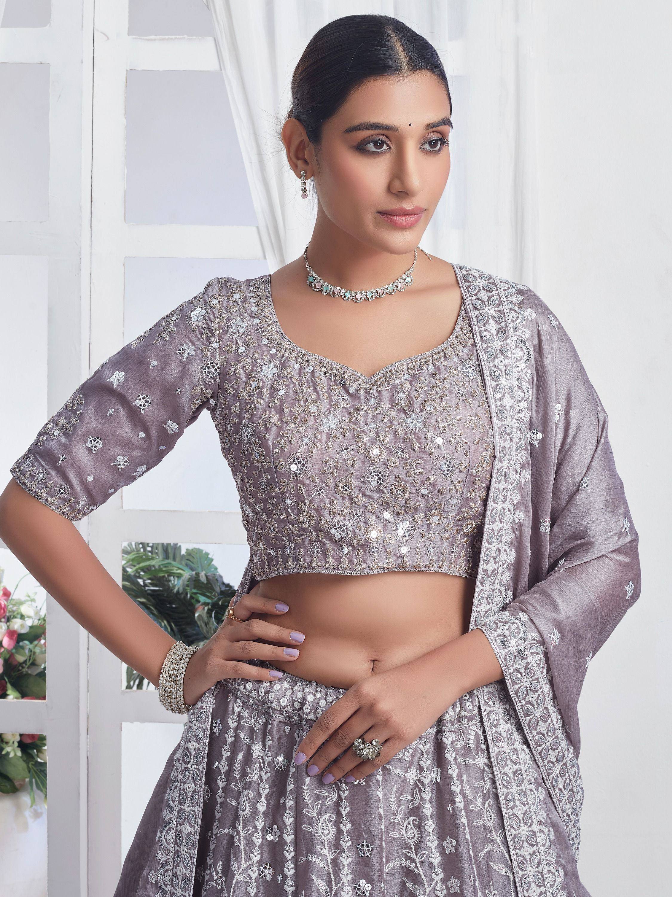 Elegant grey embroidered lehenga choli with floral motifs, perfect for Indian ethnic wear occasions.