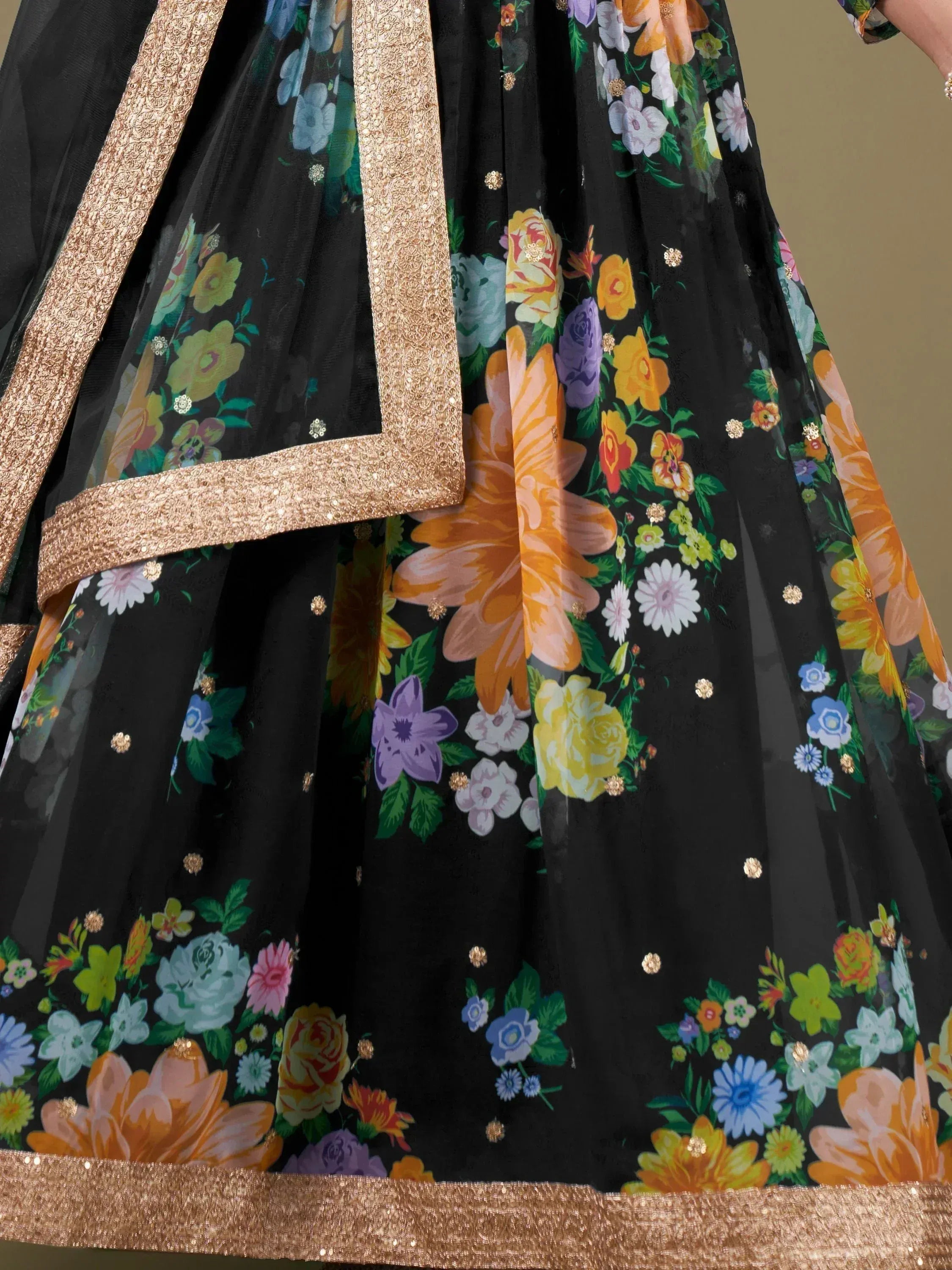 Black floral lehenga with gold sequin border and vibrant print, ethnic Indian wear