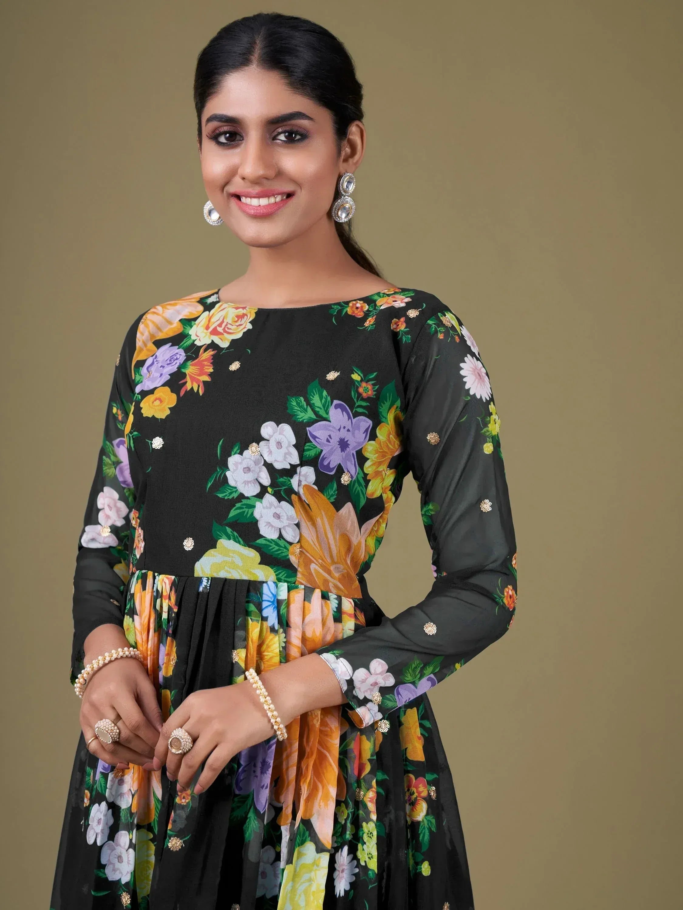 Black floral print ethnic gown with gold embellishments, perfect for Indian occasions
