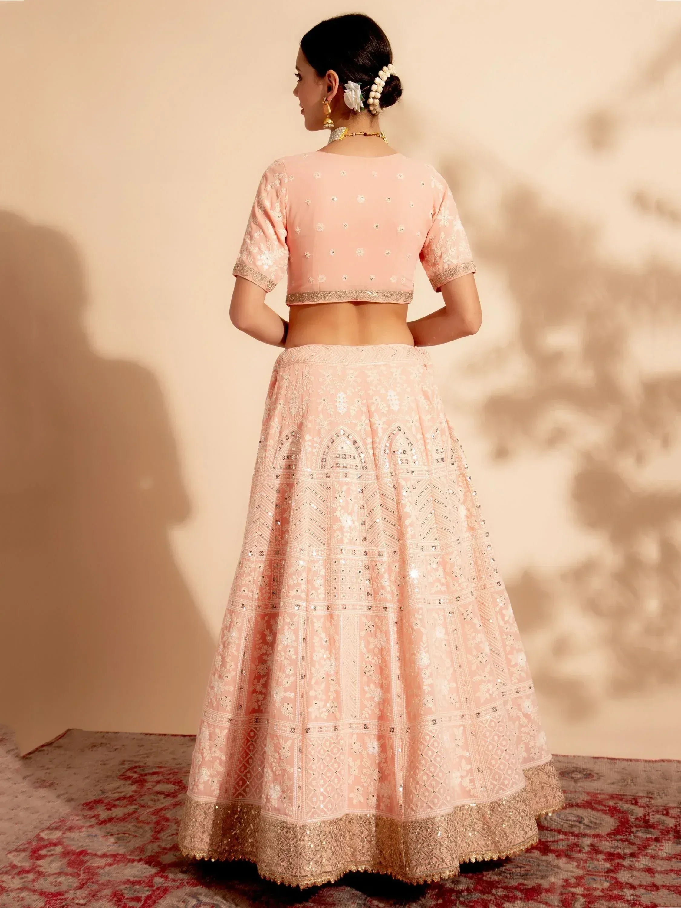 Pink embroidered lehenga choli with mirror work, perfect for Indian ethnic wear and festive occasions.