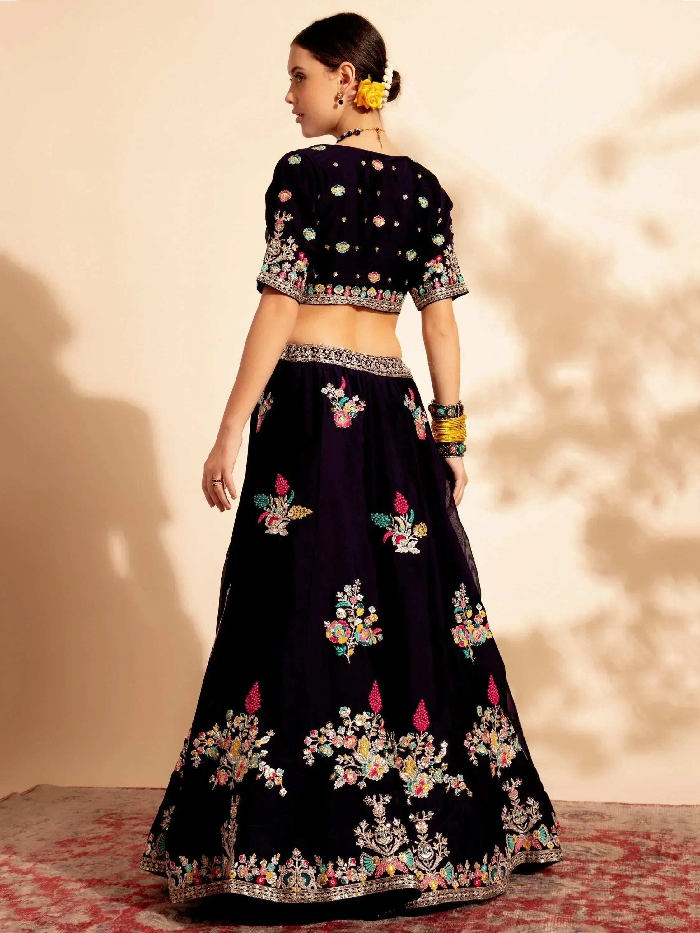 Navy blue embroidered lehenga choli with floral motifs, perfect for Indian ethnic wear and festive occasions.