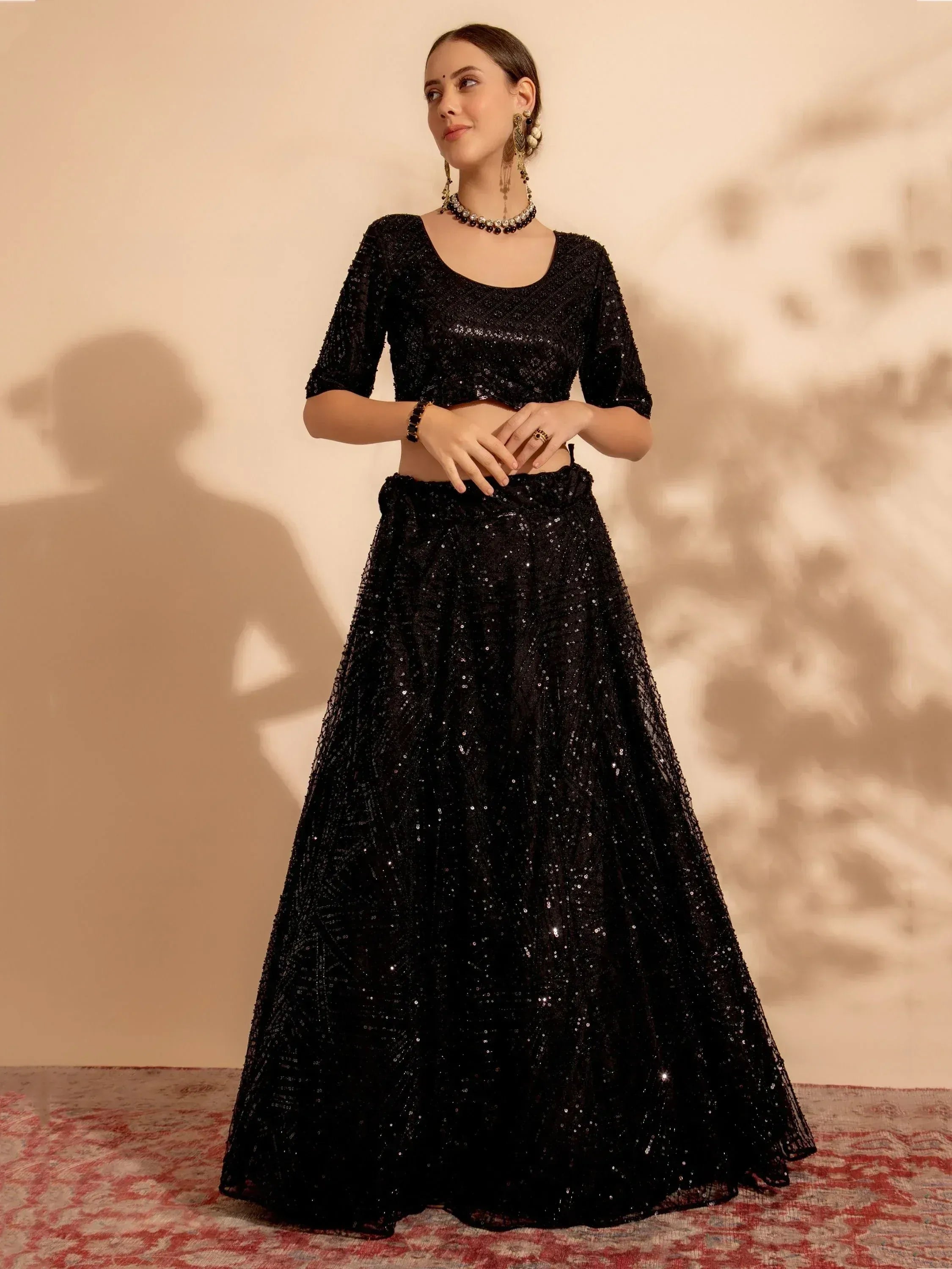 Black sequin lehenga choli with crop top, perfect for Indian ethnic wear and festive occasions.
