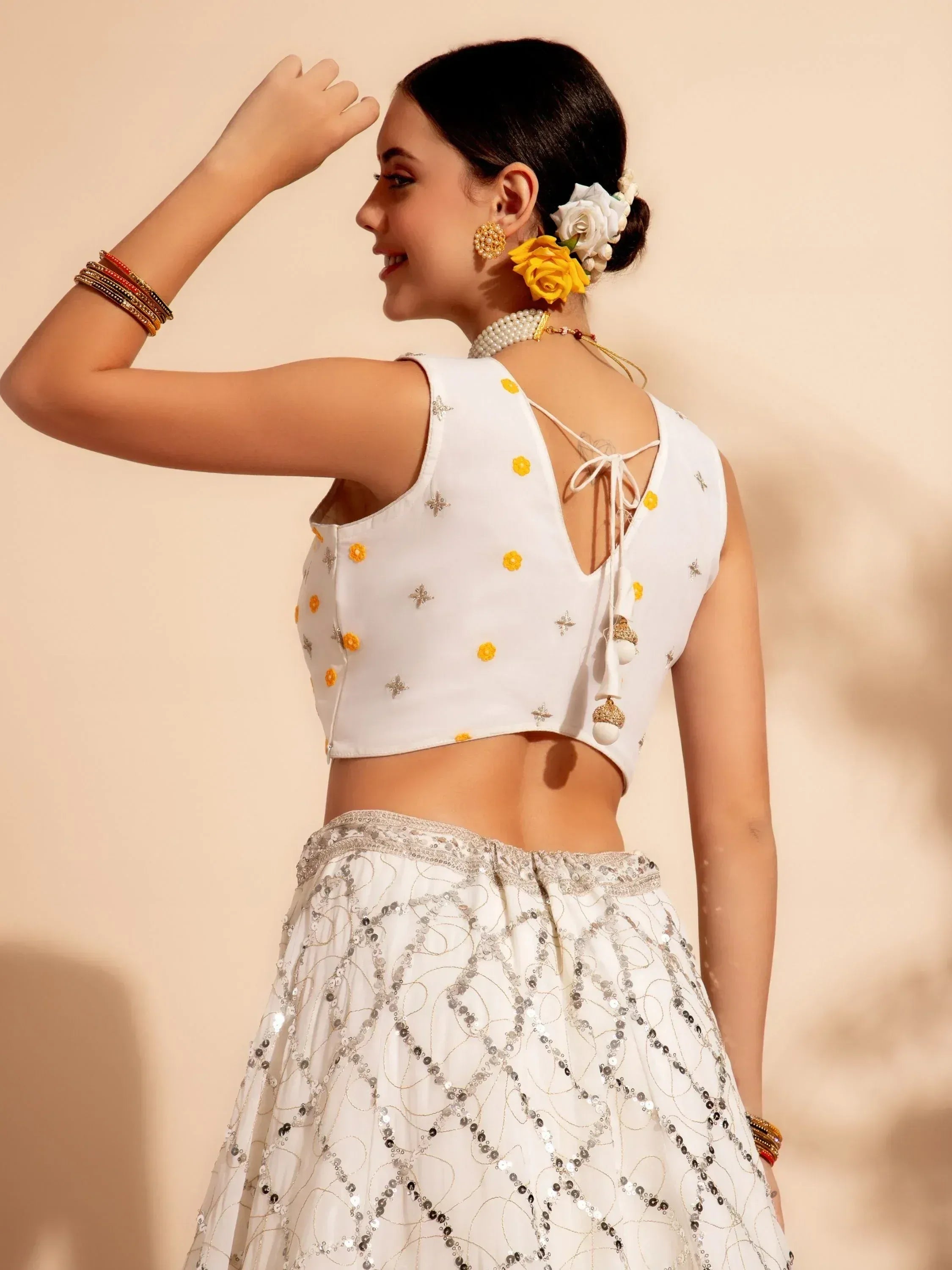 White floral embroidered lehenga choli with sequin skirt, perfect for Indian ethnic wear occasions