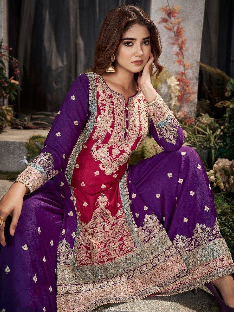 Elegant purple and maroon embroidered salwar kameez with intricate gold detailing, perfect for festive occasions.
