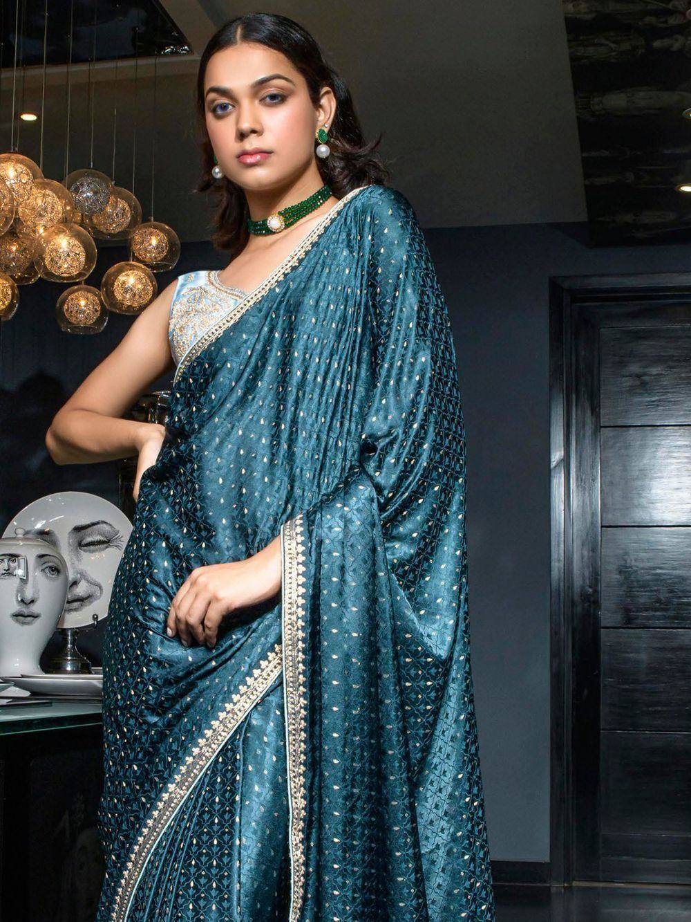 Teal designer saree with gold embroidery, perfect for Indian ethnic wear occasions