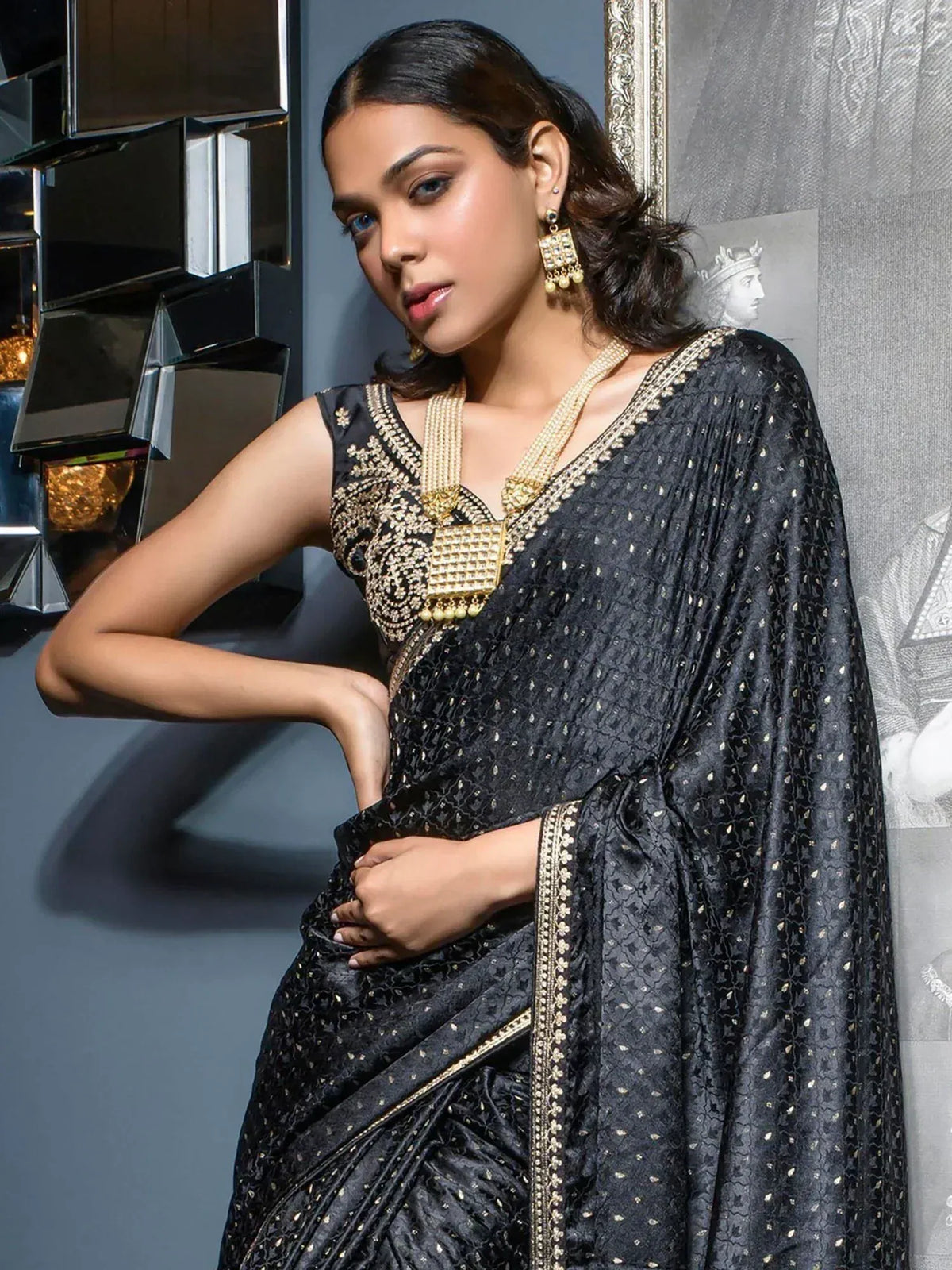 Black designer saree with gold embroidery, perfect for ethnic wear and festive occasions