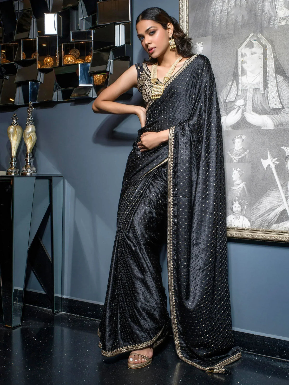 Black designer saree with gold embroidery, perfect for ethnic occasions and festive wear