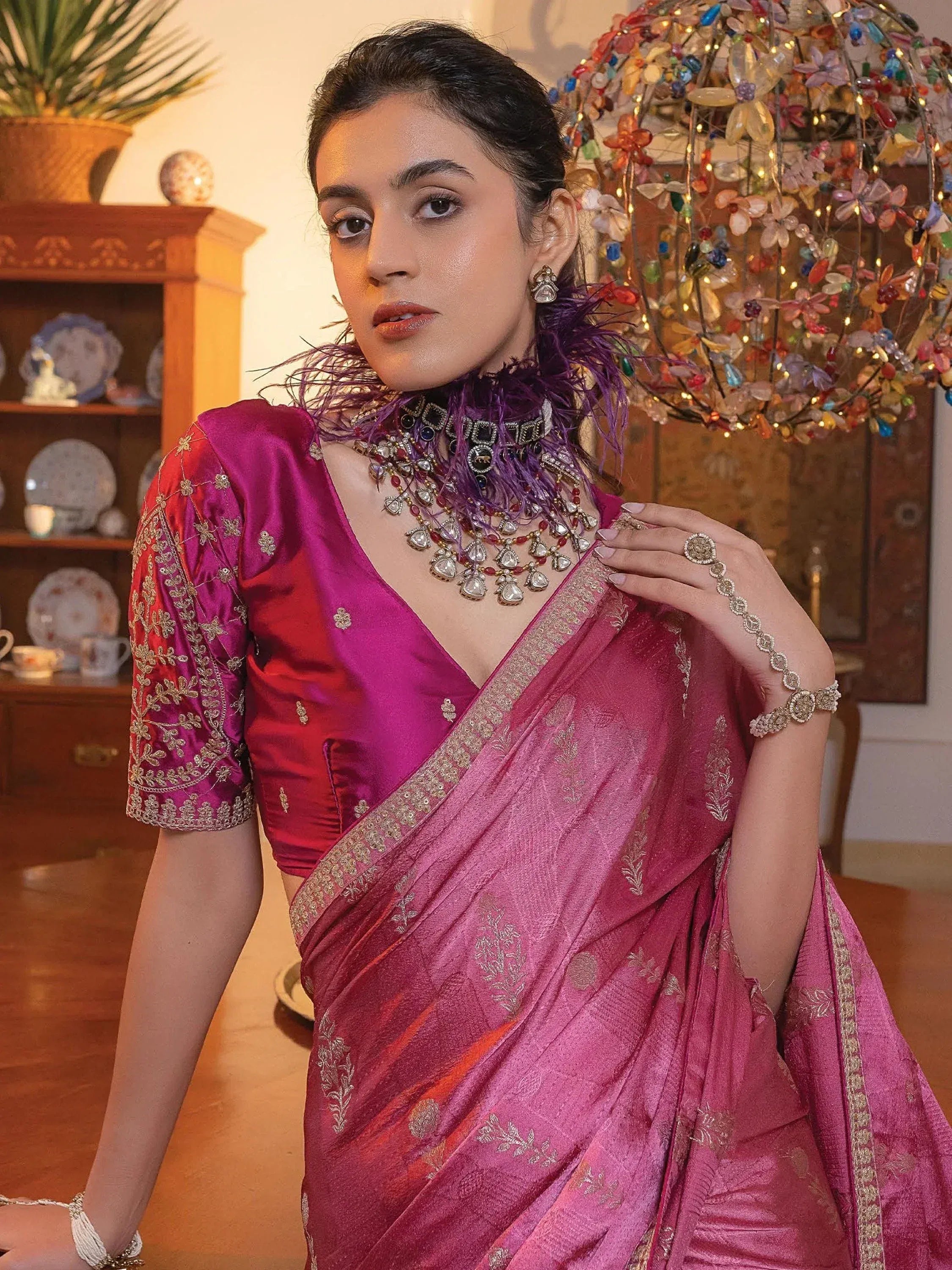 Elegant woman in purple silk saree with gold embroidery, traditional Indian ethnic wear, festive jewelry