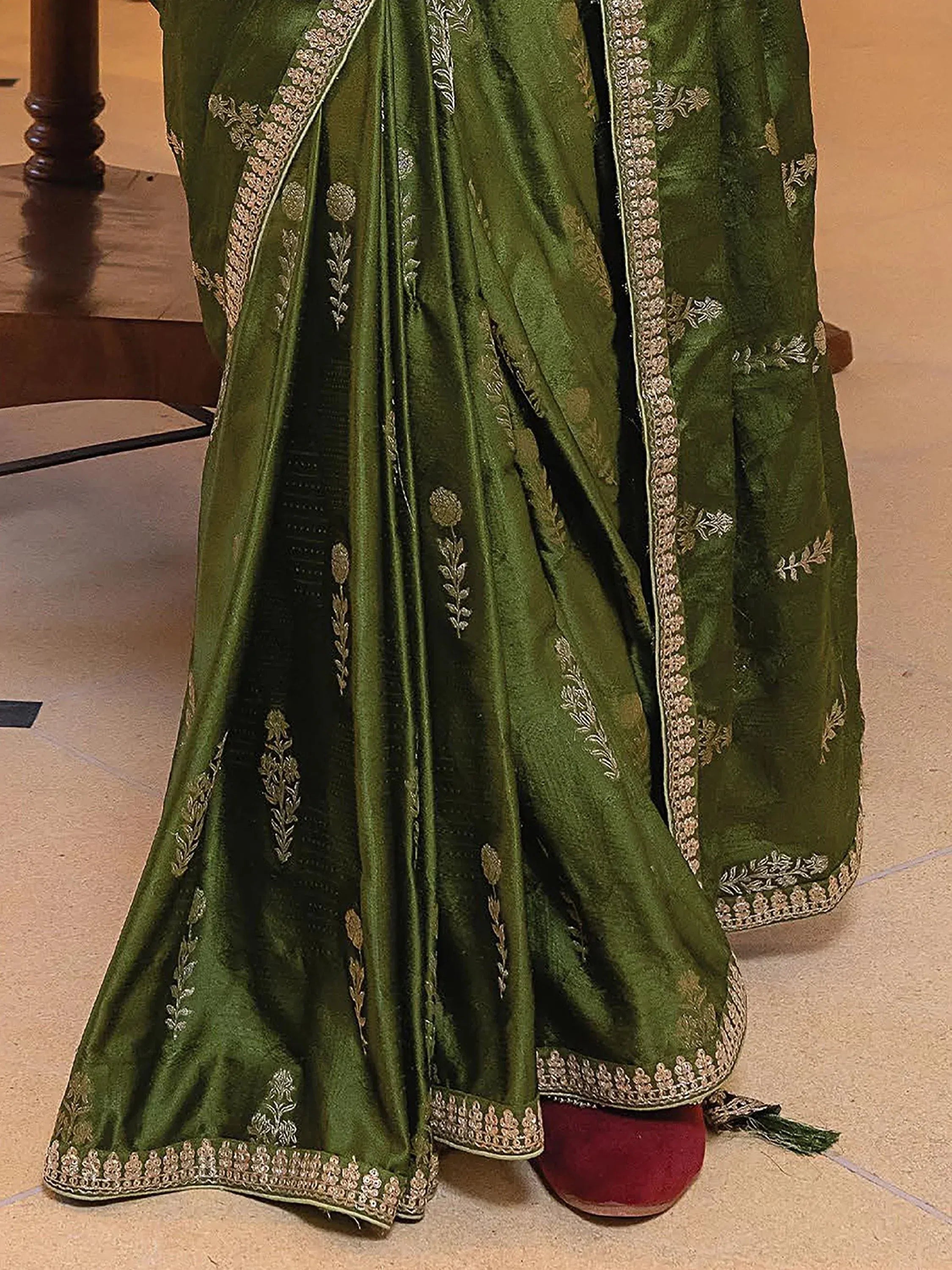 Olive green embroidered lehenga choli with gold floral detailing and border, ethnic Indian wear