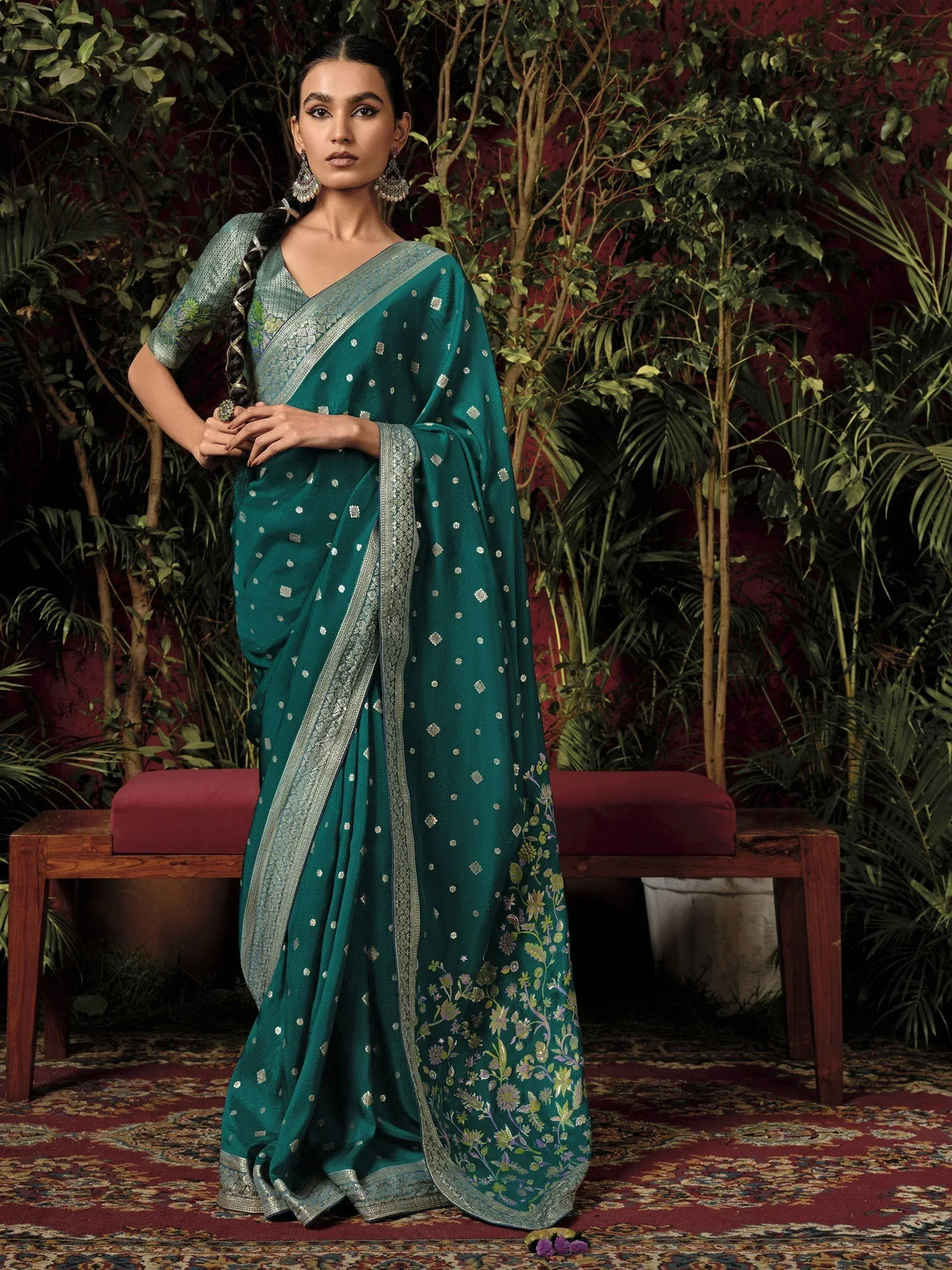 Elegant teal saree with silver floral embroidery and border, perfect for Indian ethnic occasions