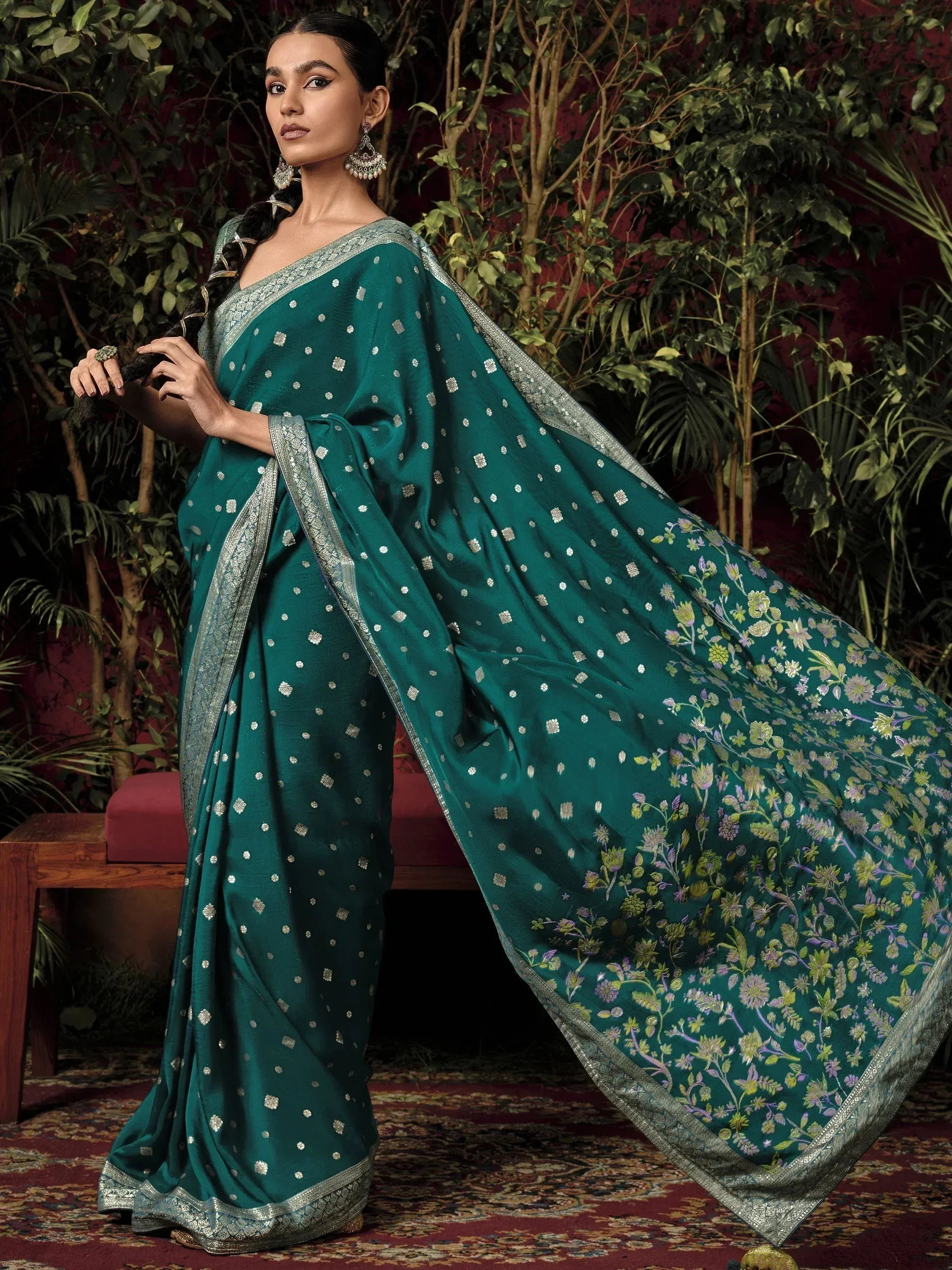 Emerald green designer saree with silver floral embroidery and zari border, perfect for Indian ethnic occasions
