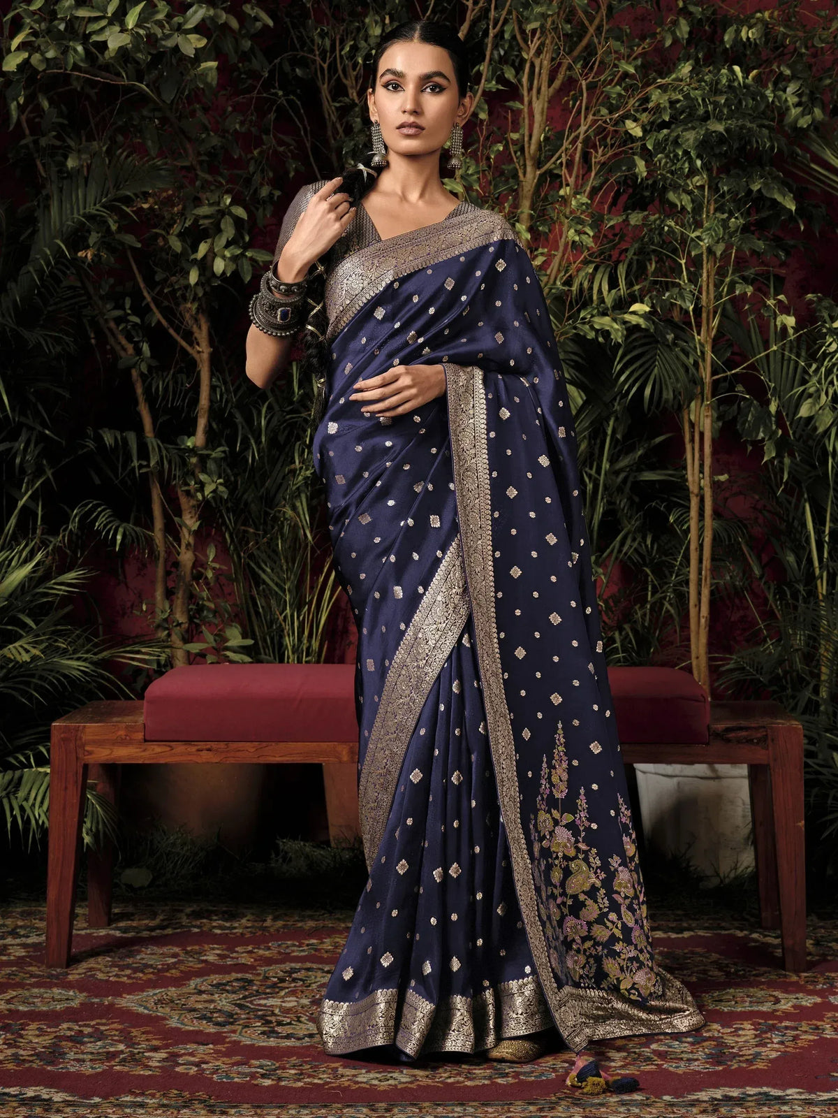 Navy blue designer saree with gold embroidery and floral border, perfect for Indian ethnic wear occasions