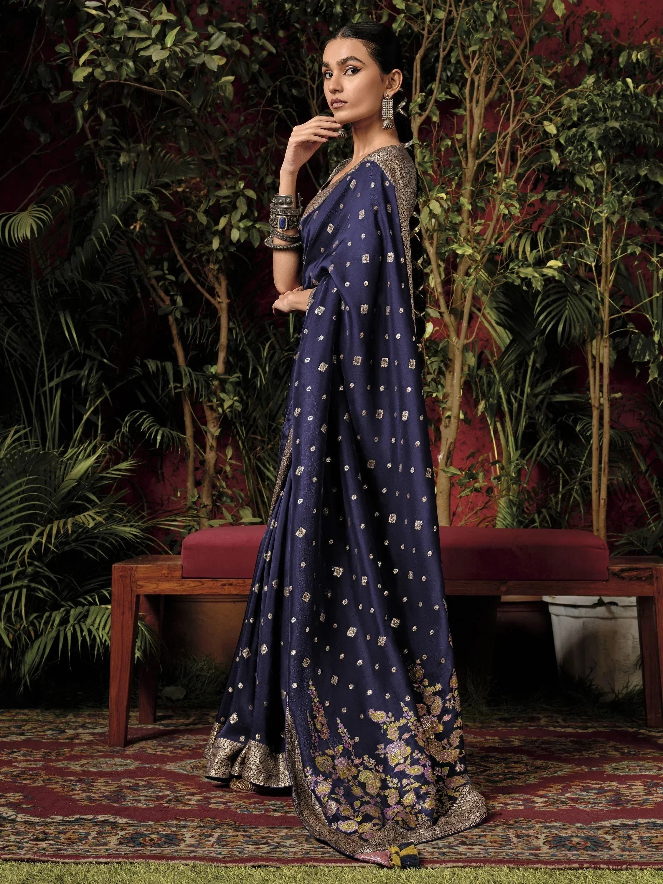 Navy blue designer saree with gold floral embroidery and border, perfect for Indian ethnic occasions