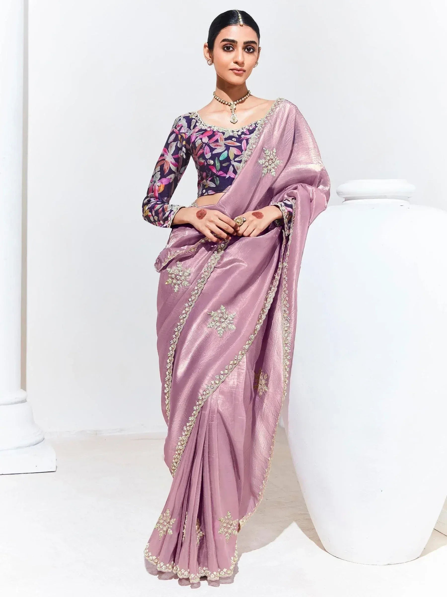 Elegant mauve saree with floral blouse and gold embroidery, perfect for Indian ethnic occasions