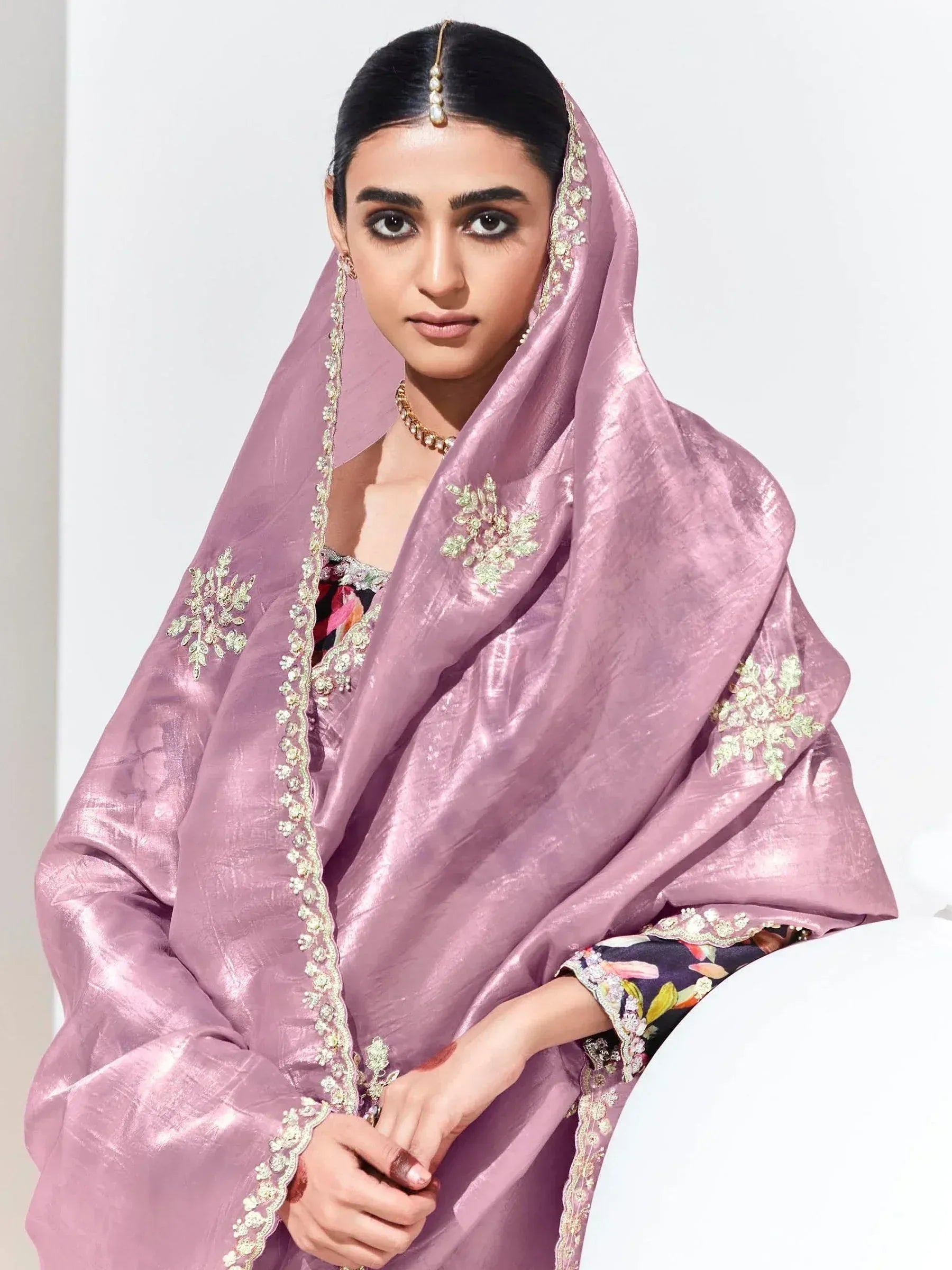 Elegant pink embroidered dupatta with floral motifs, paired with floral print ethnic wear for women