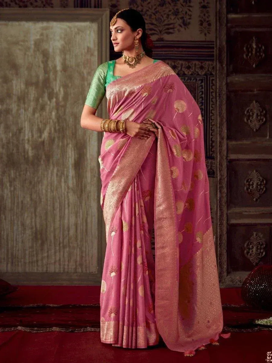 Pink floral saree with gold embroidery, paired with green blouse, traditional Indian ethnic wear