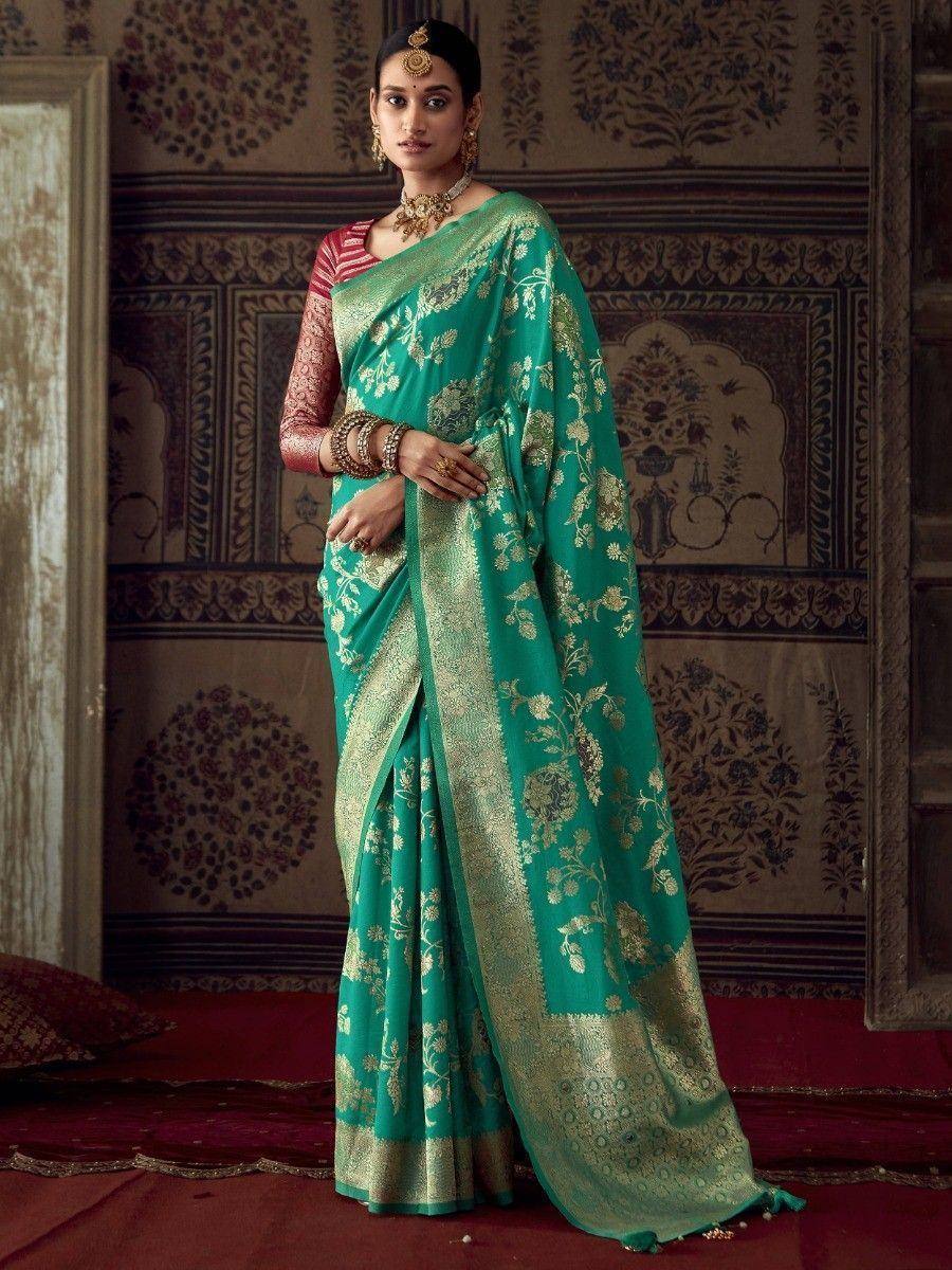 Teal green designer saree with gold floral embroidery and border, paired with red blouse, traditional Indian ethnic wear