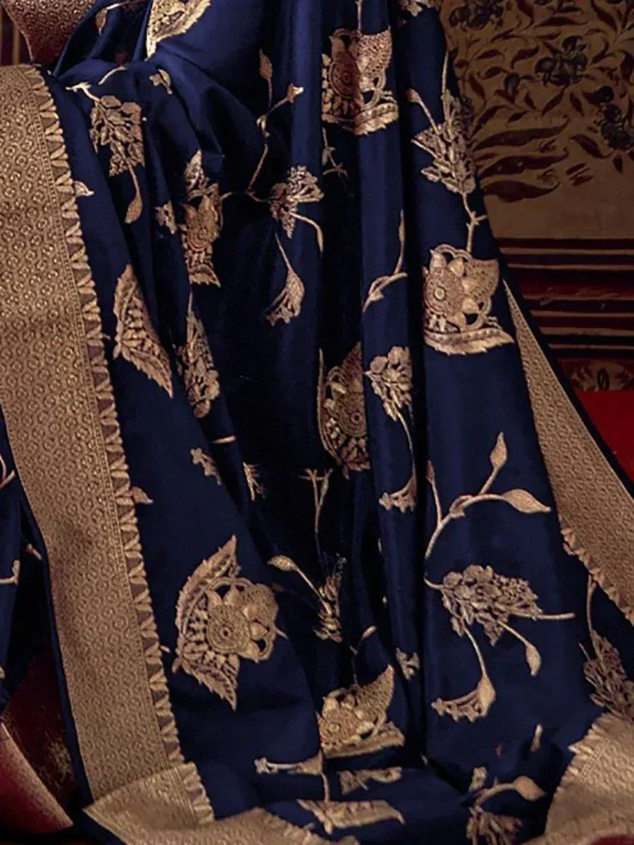 Navy blue saree with gold floral embroidery and woven border, ideal for ethnic occasions