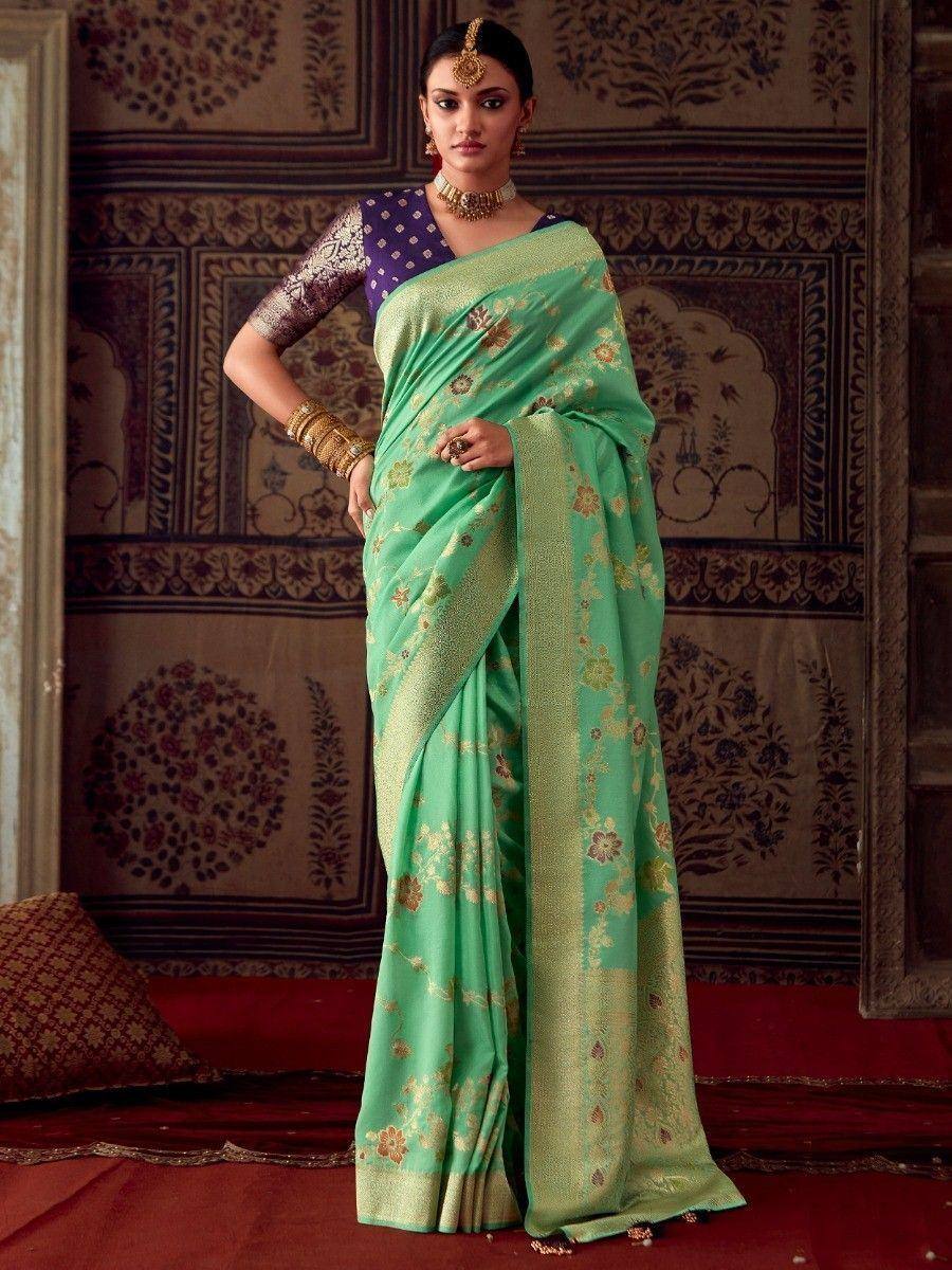 Mint green floral saree with gold border, paired with purple blouse, perfect for Indian ethnic occasions
