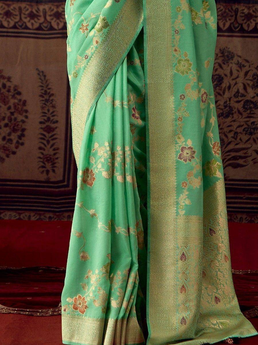 Mint green floral saree with gold zari border, elegant Indian ethnic wear for women