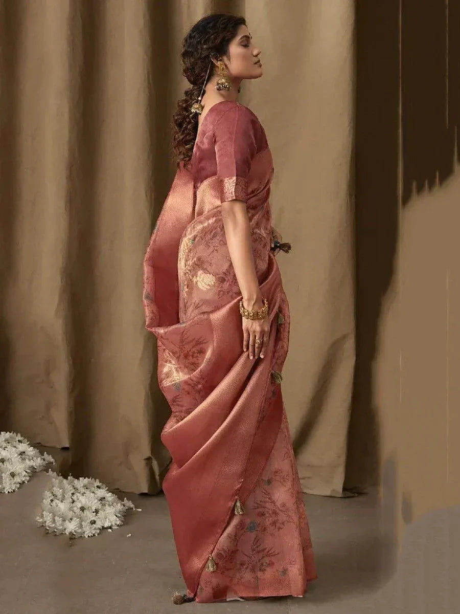 Elegant pink floral saree with gold embroidery, perfect for Indian ethnic wear occasions