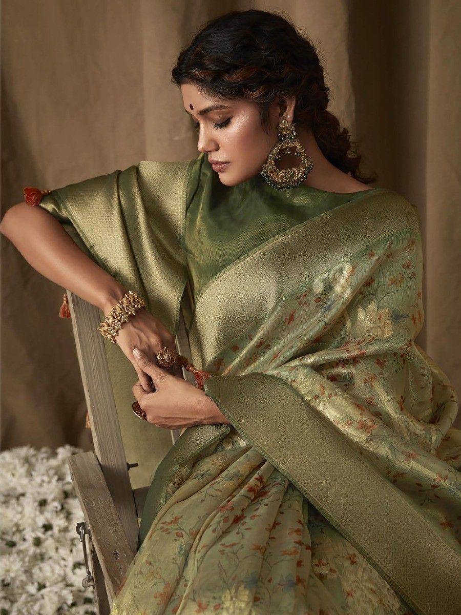 Elegant olive green floral saree with gold embroidery, styled with traditional jewelry for ethnic occasions