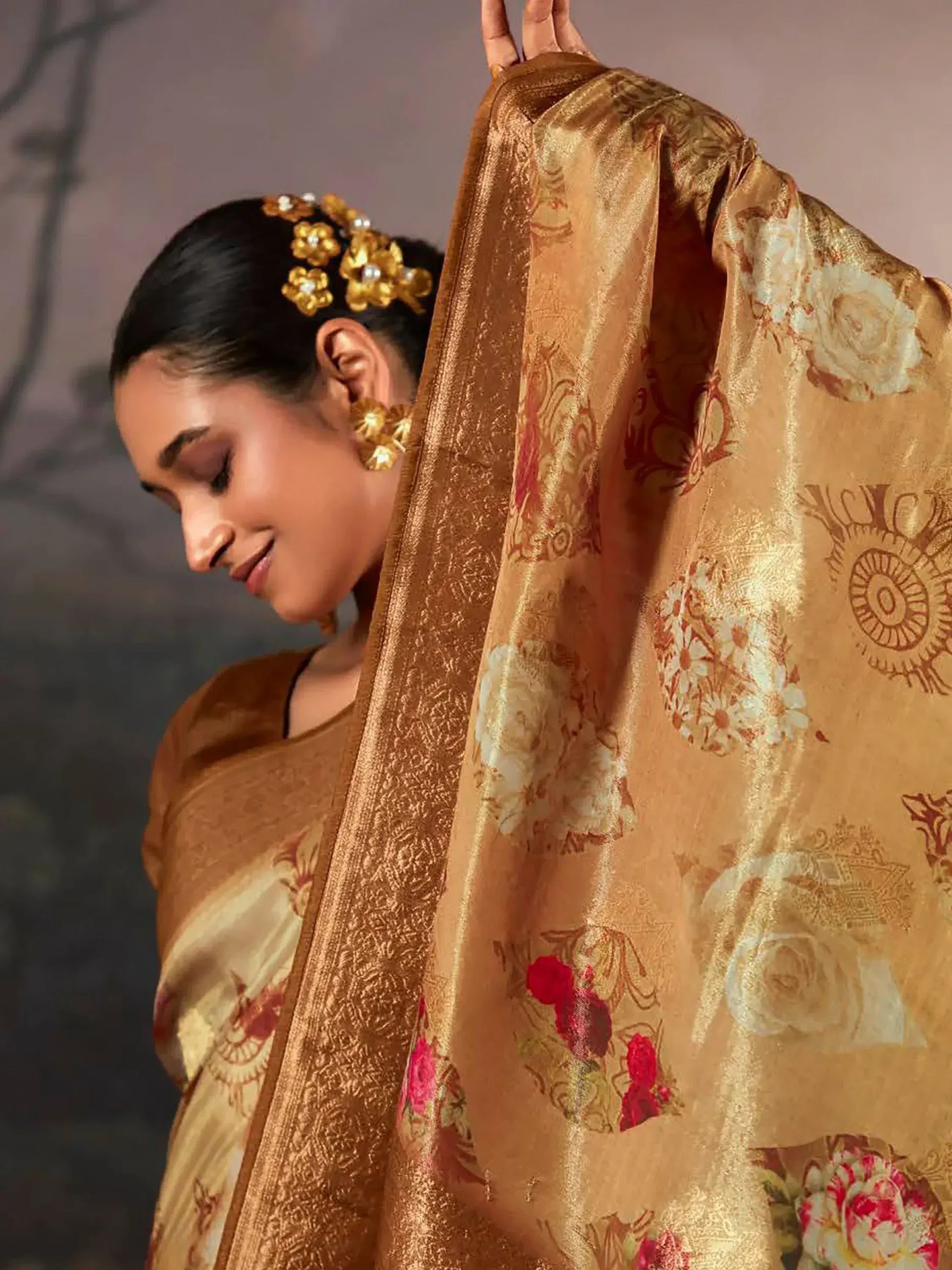 Elegant golden saree with floral print and intricate border, perfect for Indian ethnic occasions