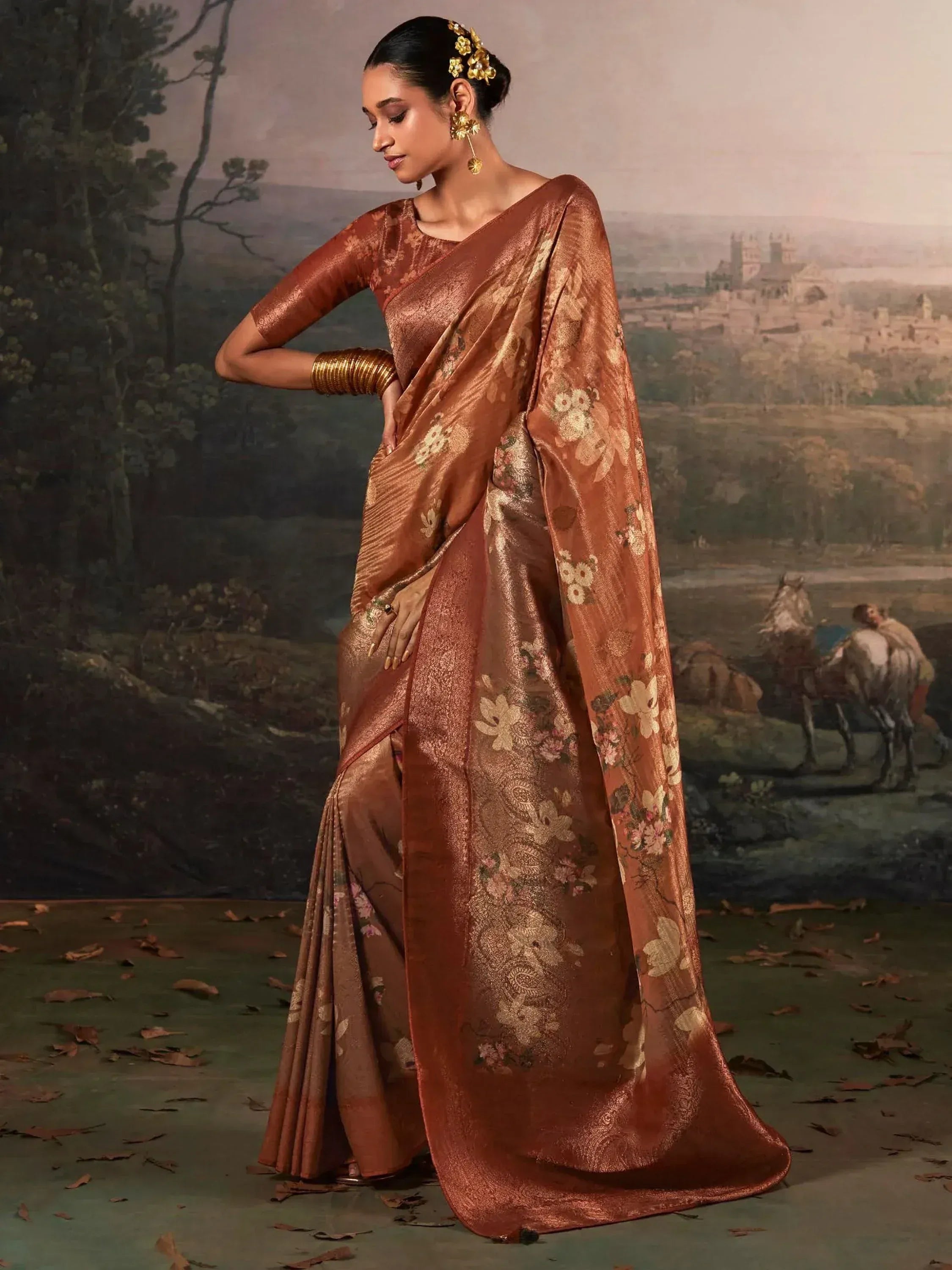 Elegant brown floral saree with gold embroidery, perfect for Indian ethnic wear occasions