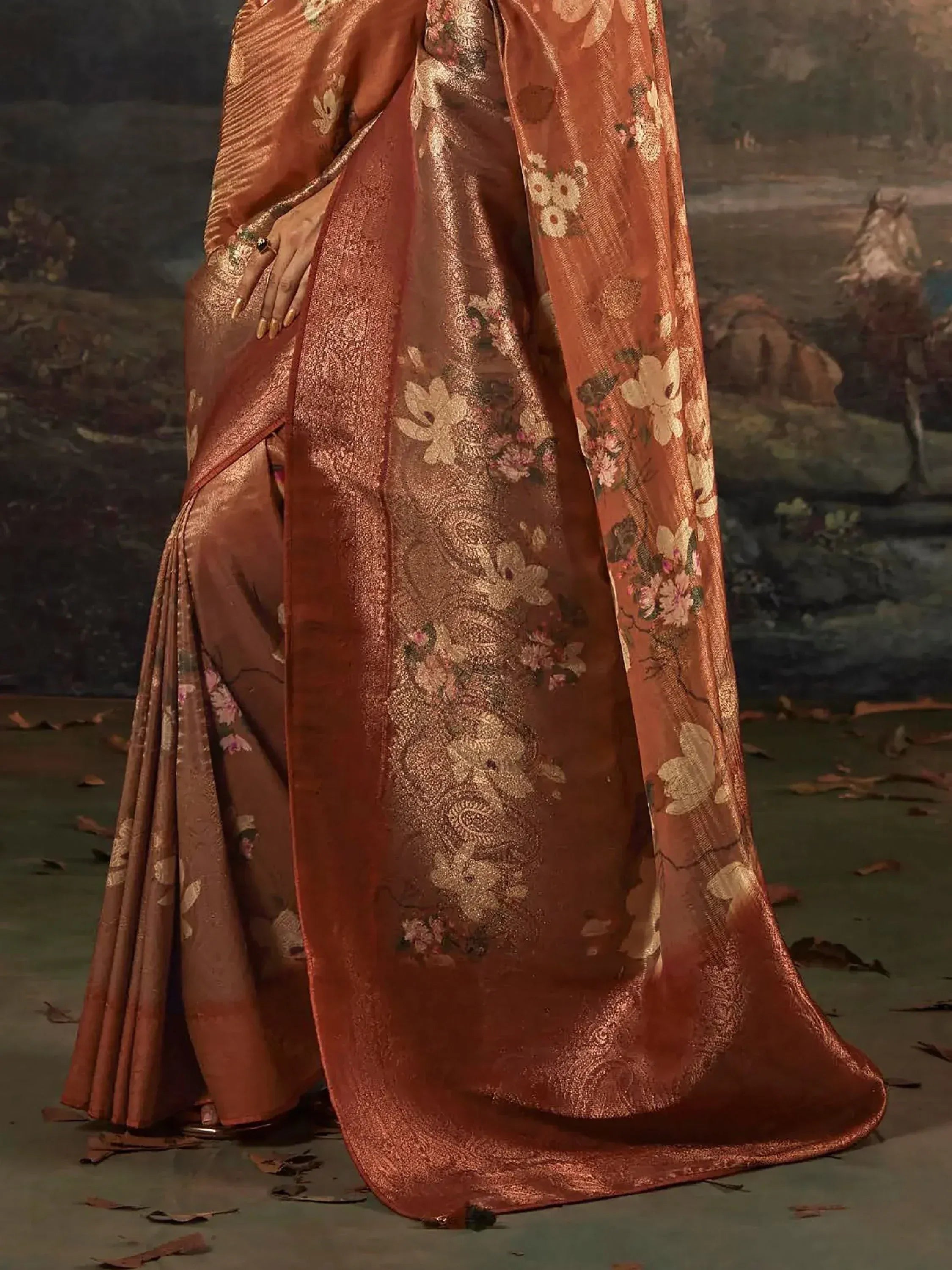 Elegant rust saree with gold floral embroidery, perfect for Indian ethnic wear occasions.