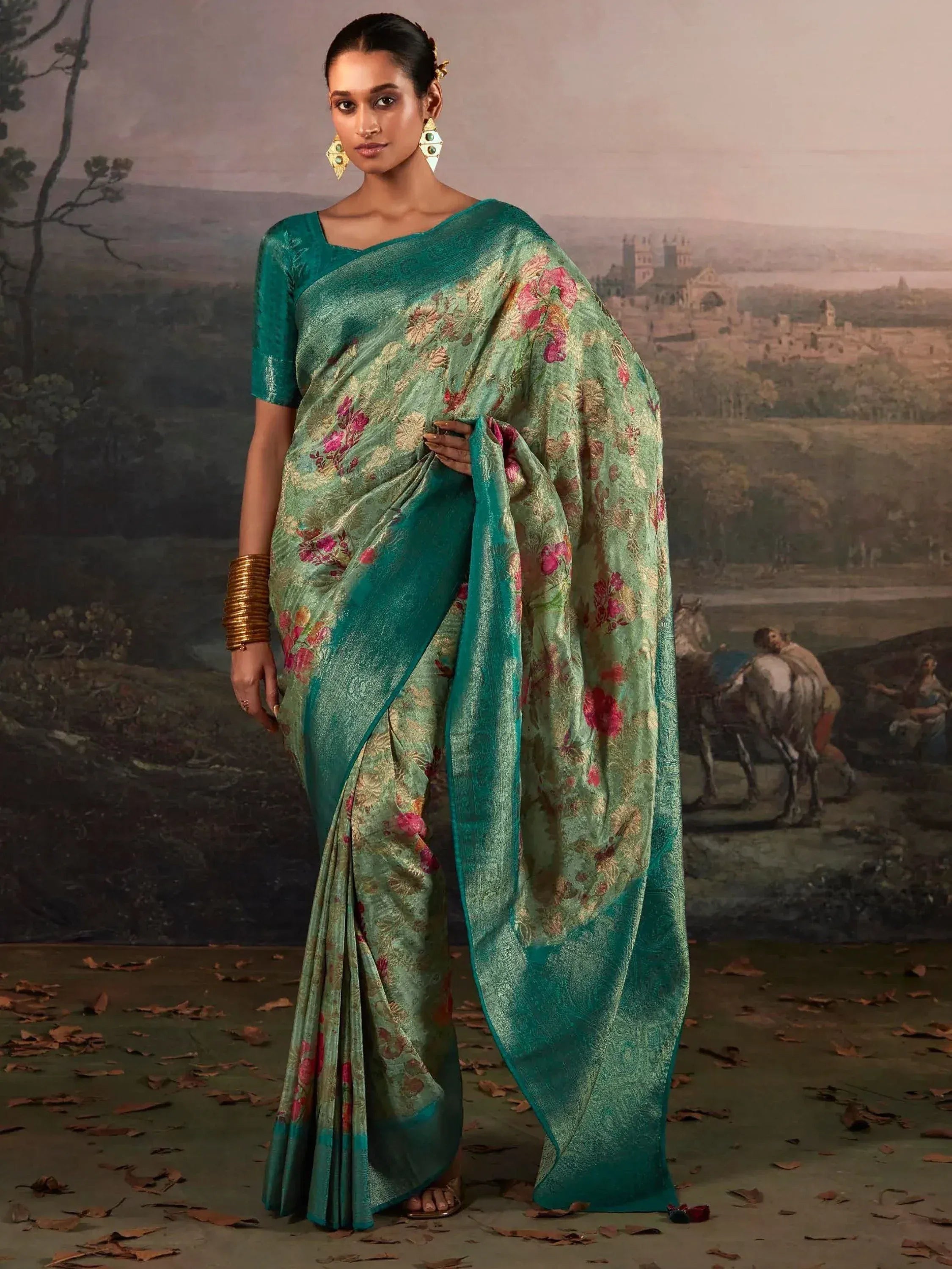 Teal floral designer saree with gold embroidery, perfect for Indian ethnic wear occasions