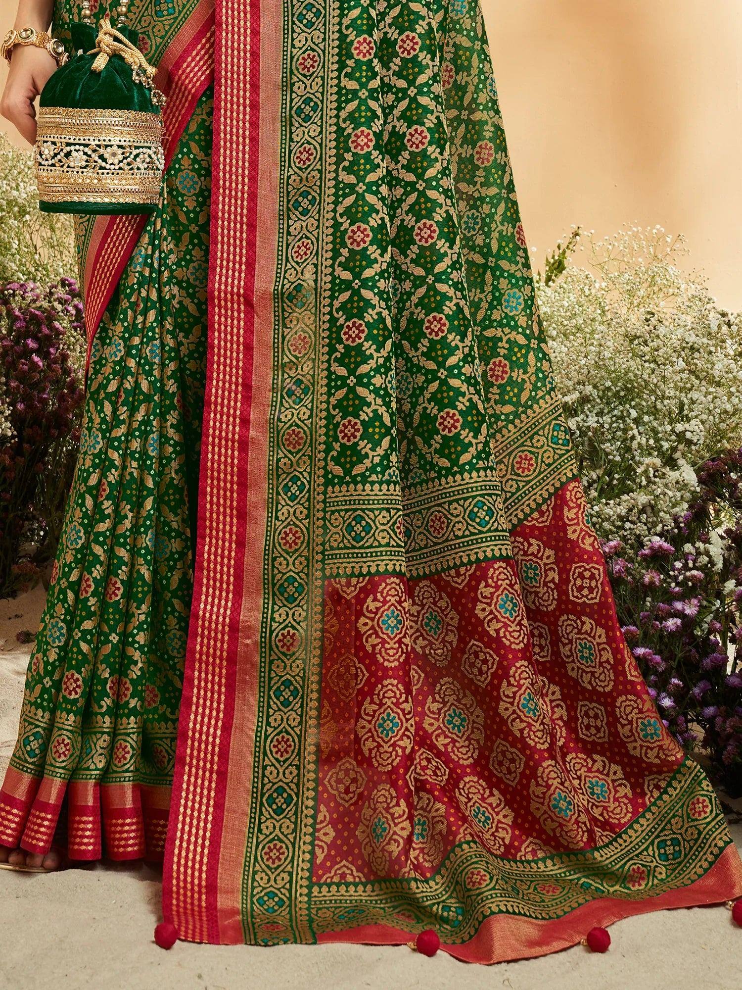 Green and red floral ethnic saree with gold embroidery and pom-pom border