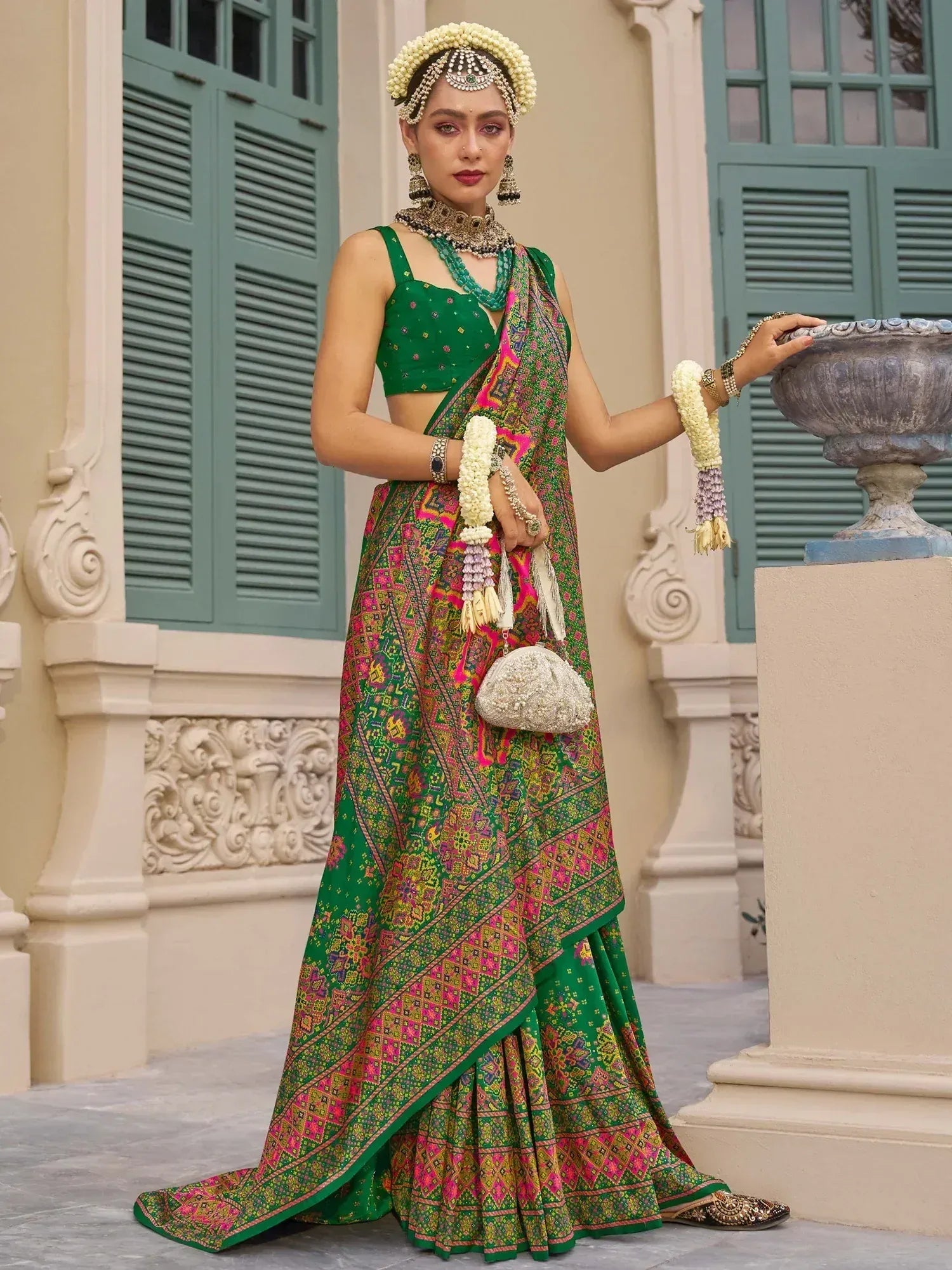 Green printed lehenga choli with floral jewelry, perfect for Indian ethnic wear and festive occasions